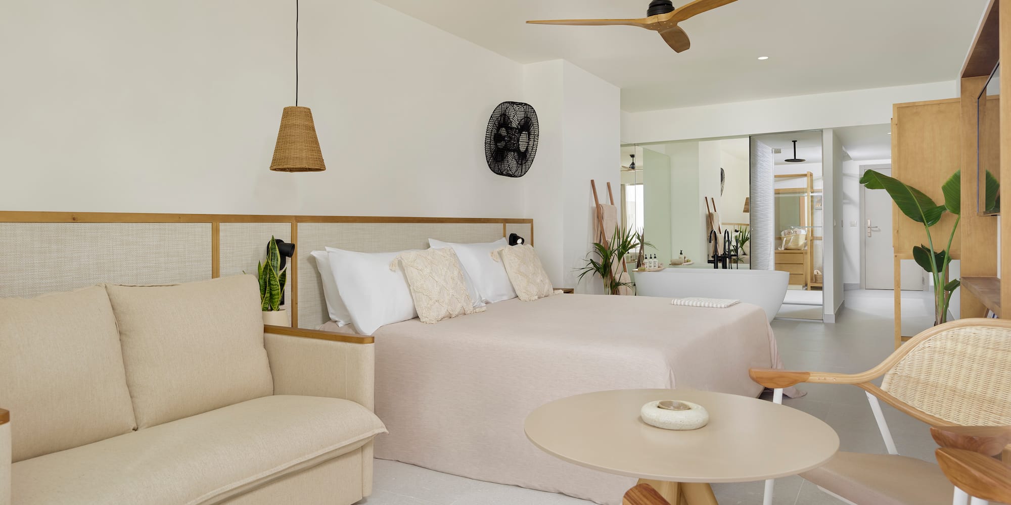 a bedroom with a bed and a tub