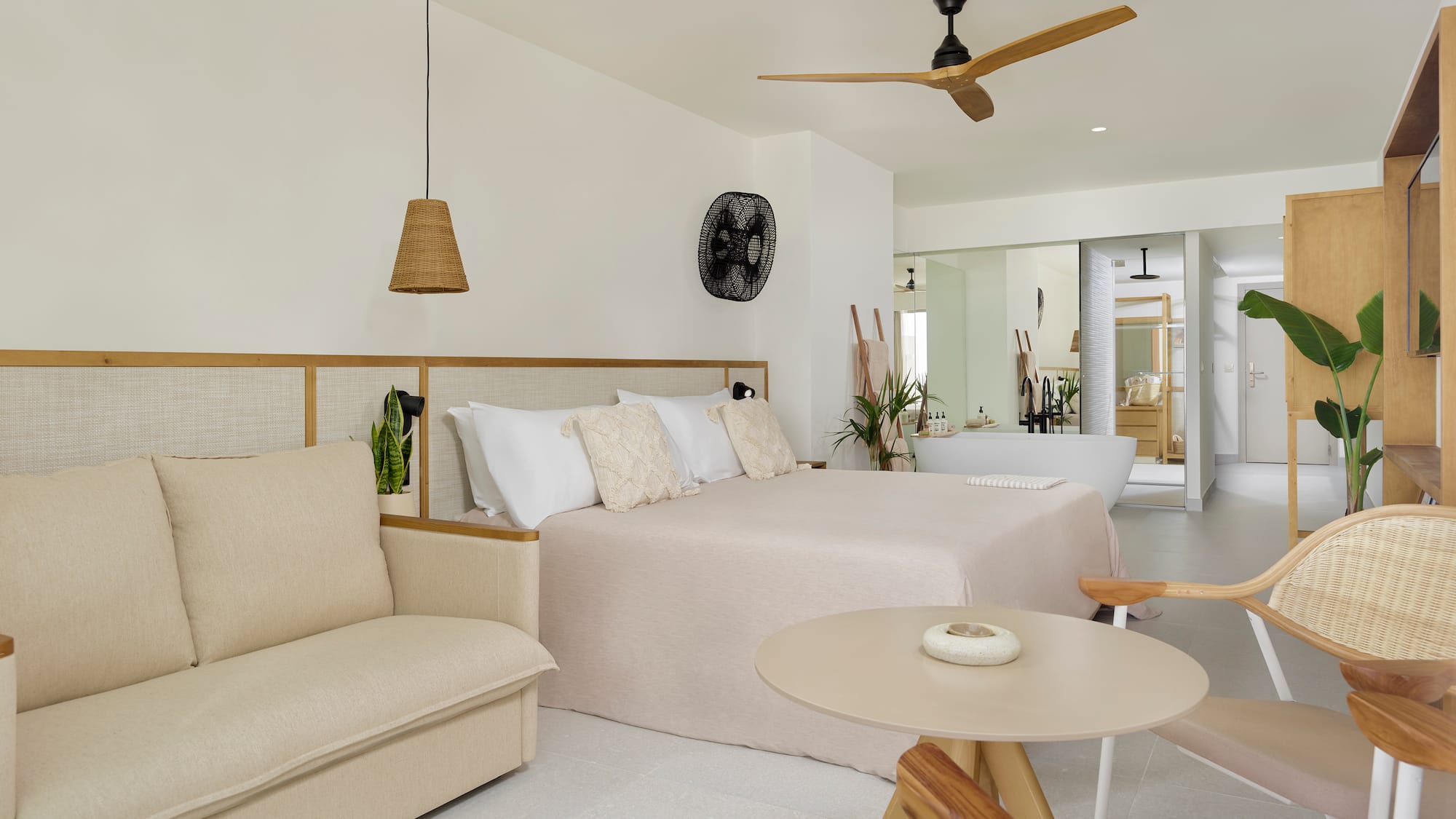 a bedroom with a bed and a tub