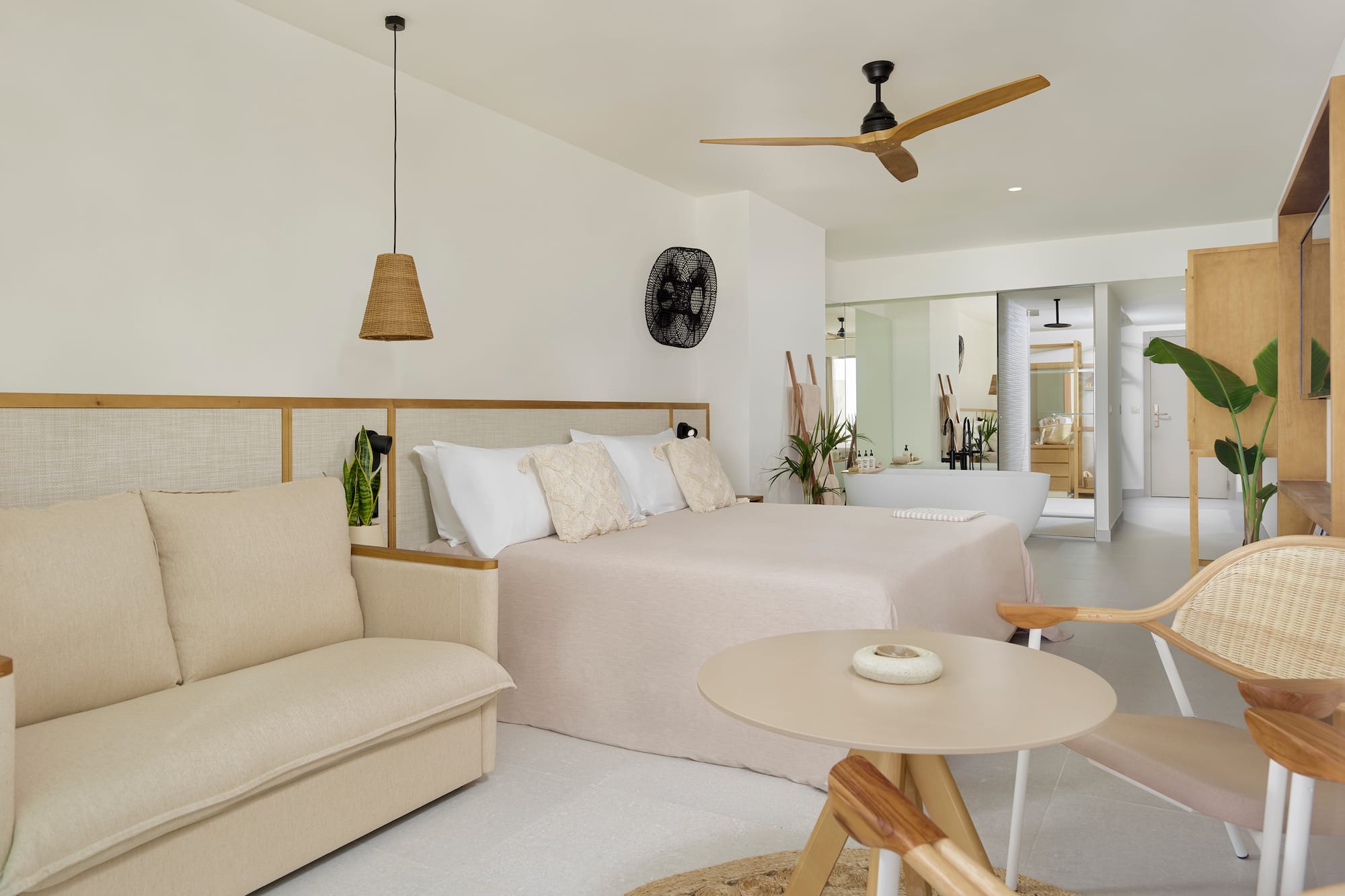 a bedroom with a bed and a tub