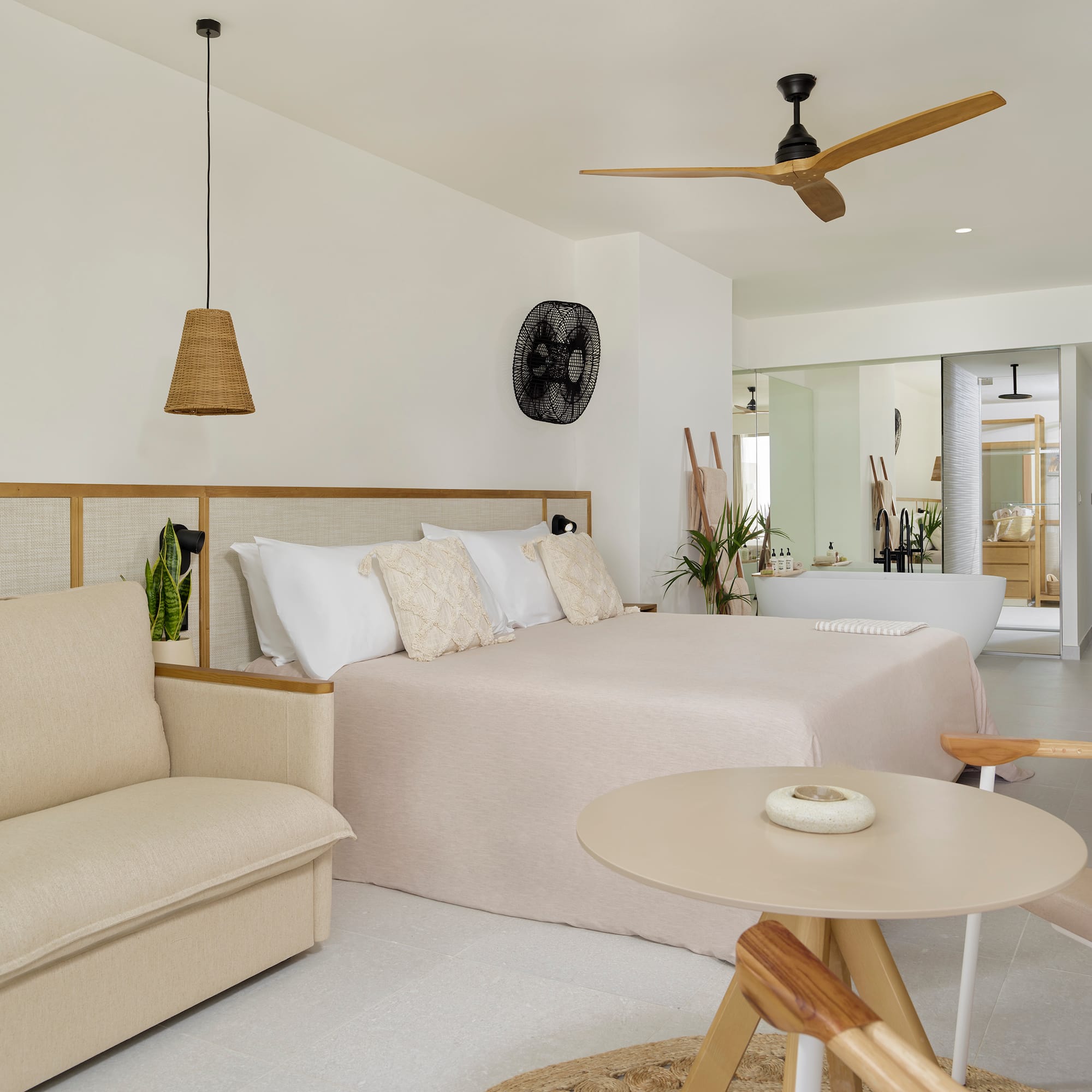 a bedroom with a bed and a tub