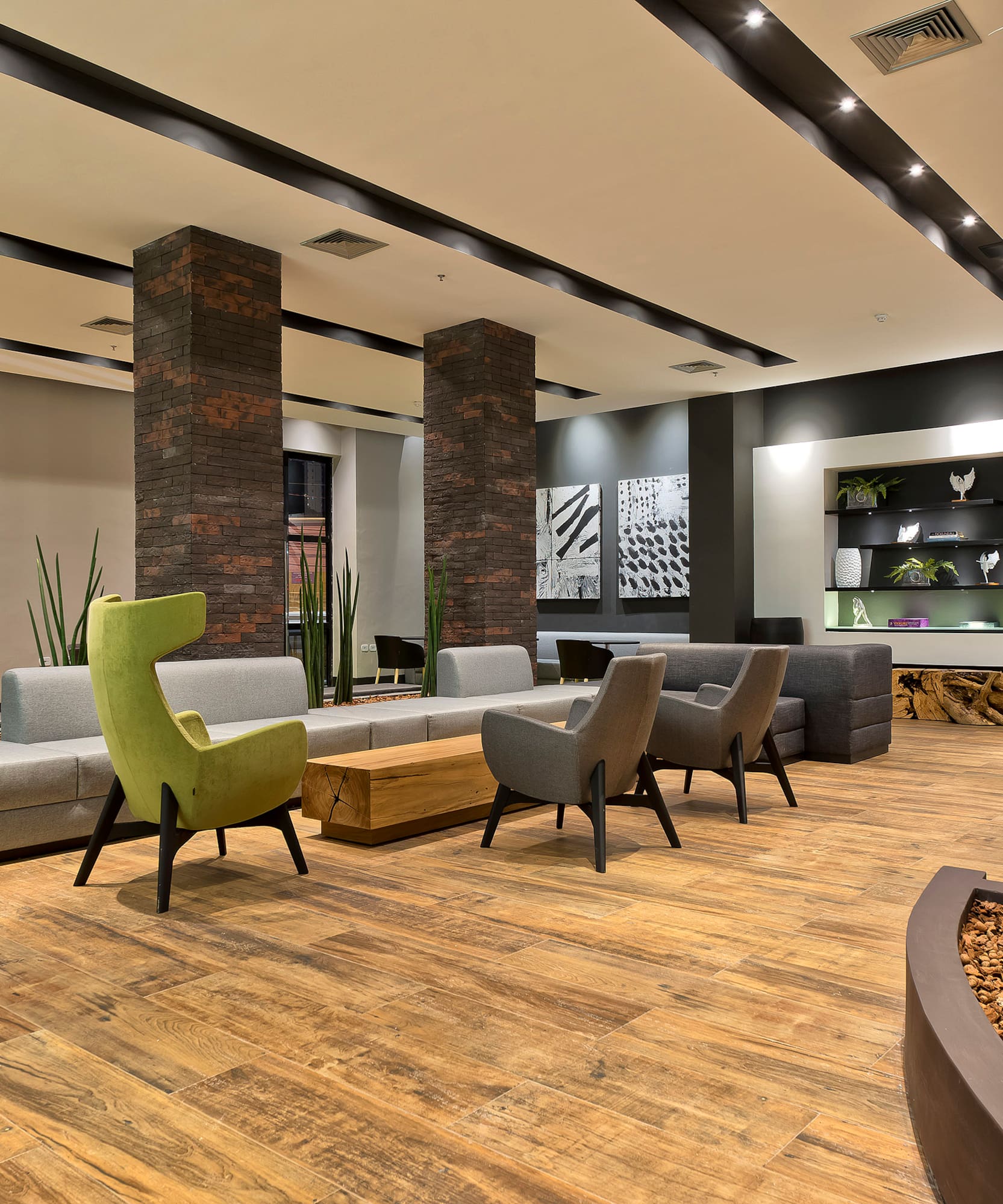 a room with a couch and chairs