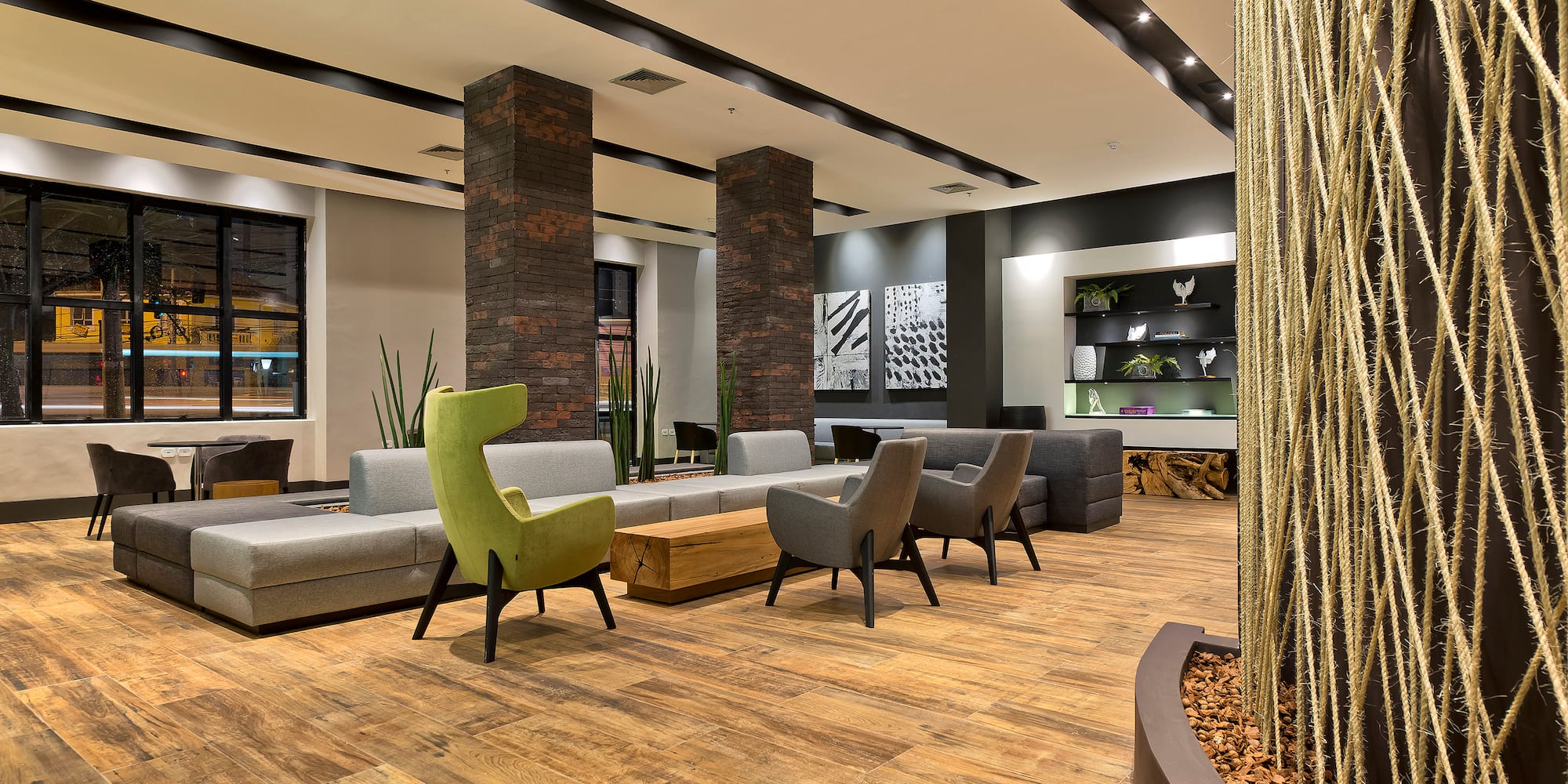 a room with a couch and chairs