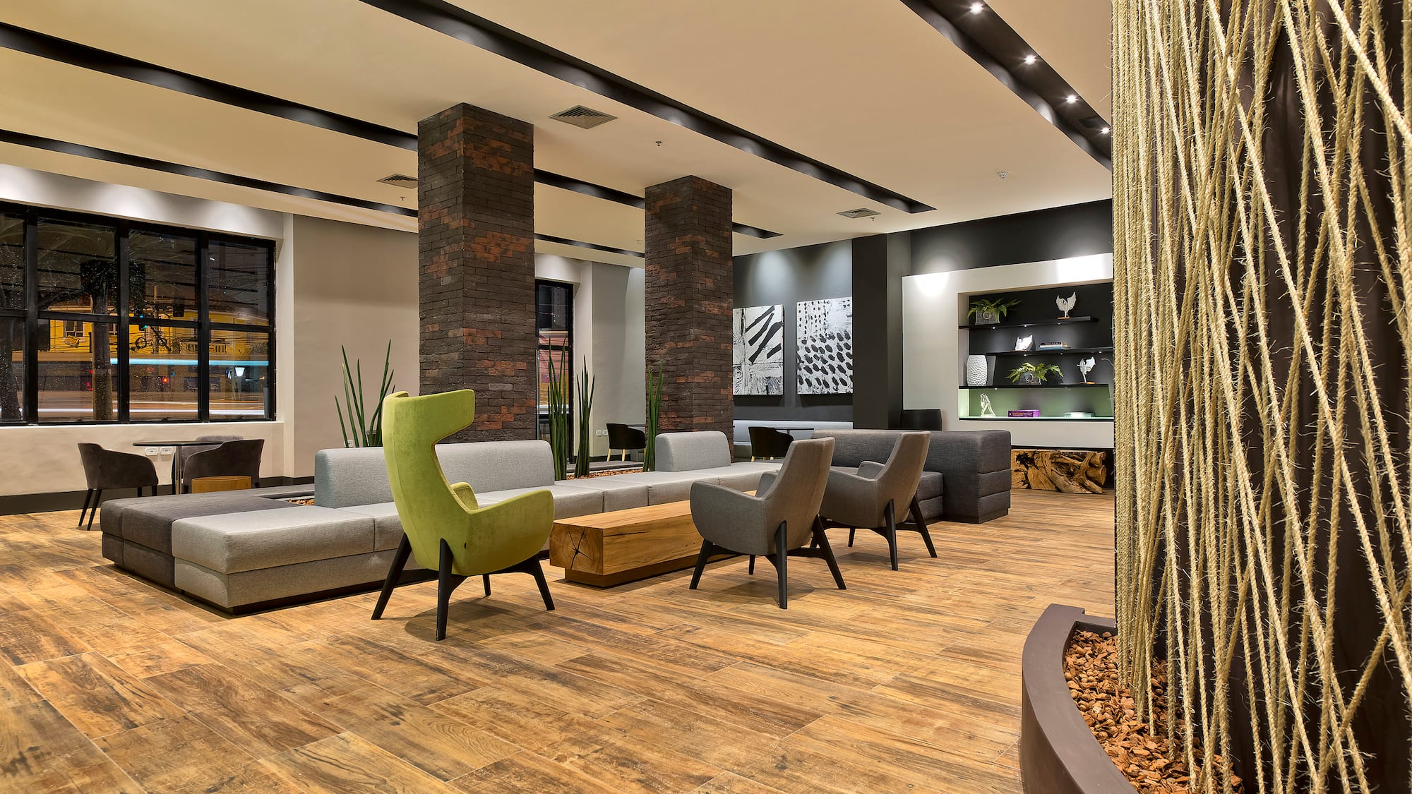 a room with a couch and chairs