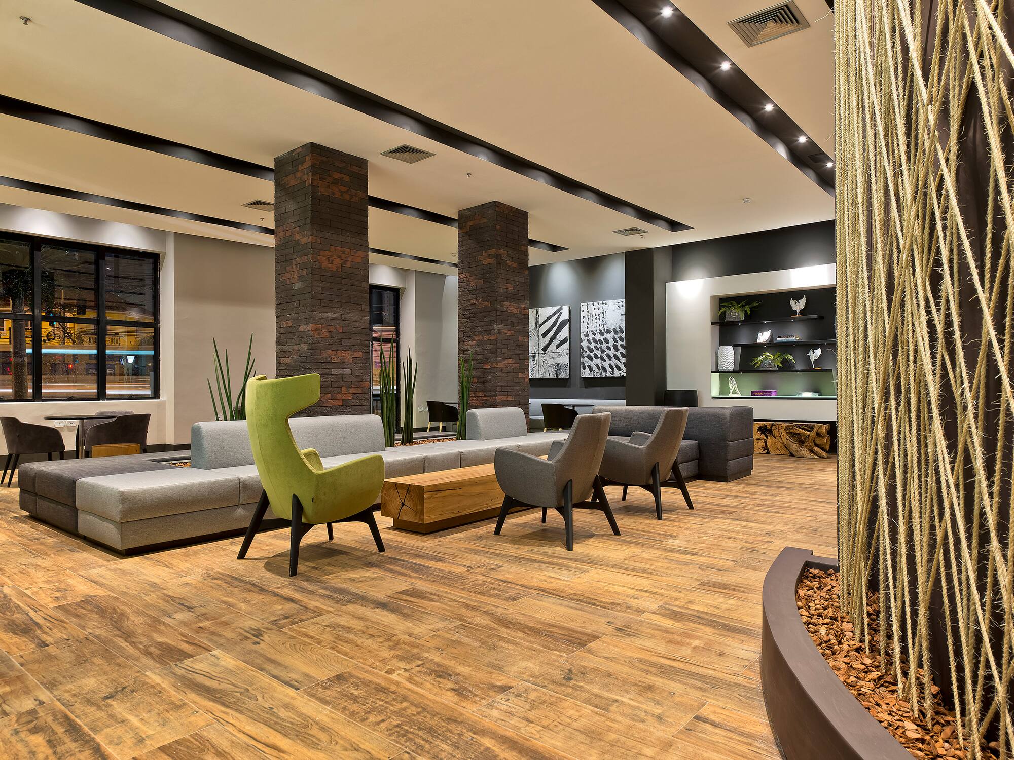 a room with a couch and chairs