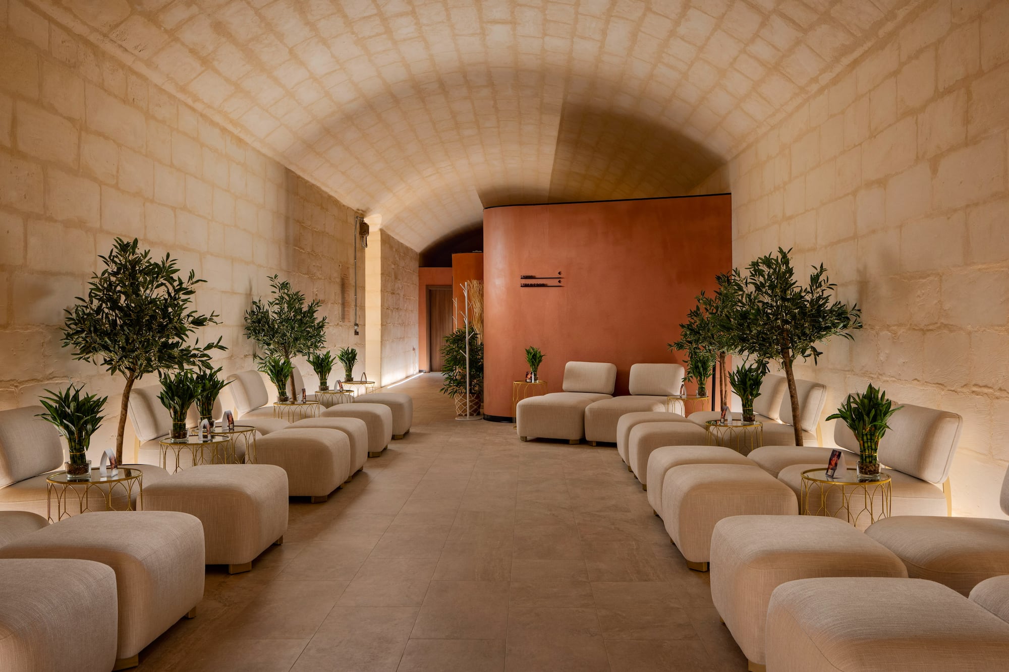 a room with white chairs and tables