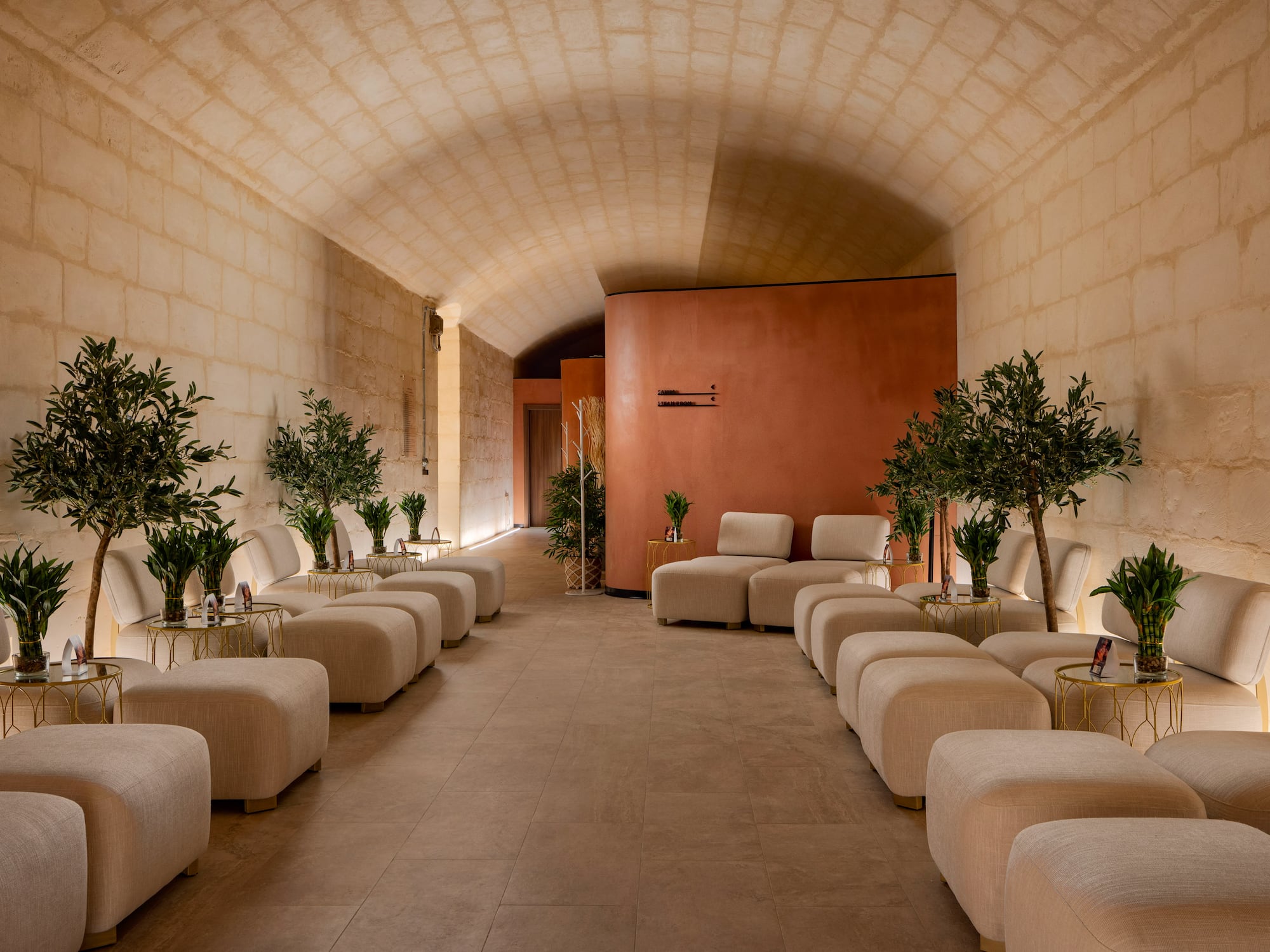 a room with white chairs and tables