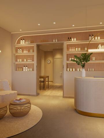 a room with a reception desk and shelves with bottles