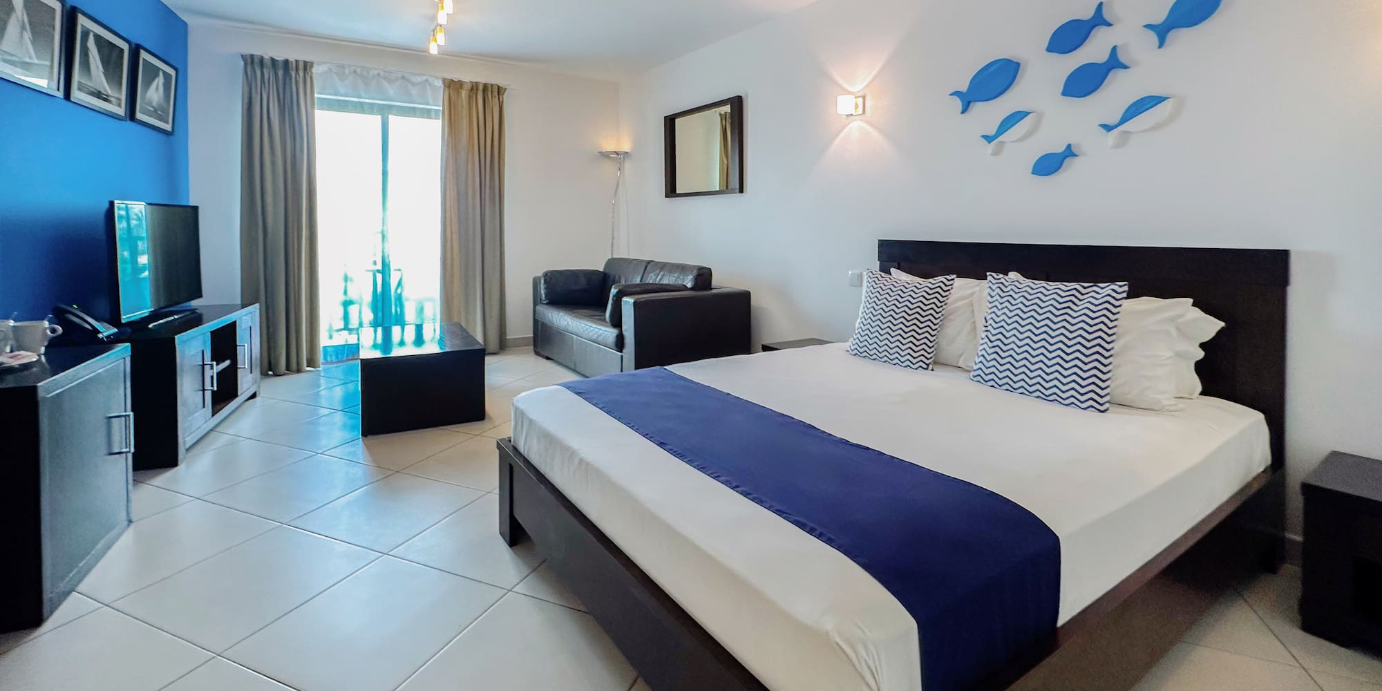 a bedroom with a bed and tv