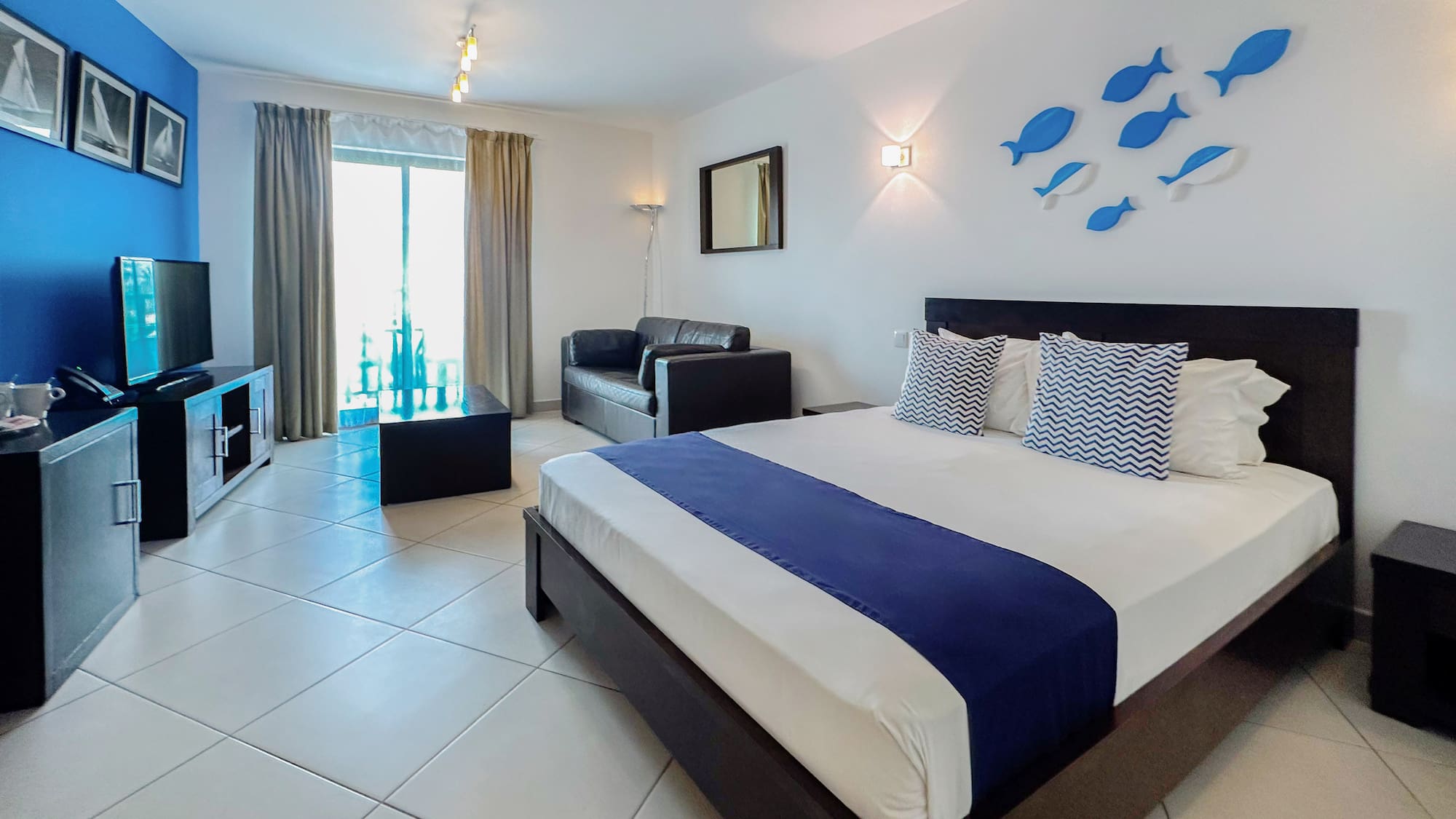 a bedroom with a bed and tv