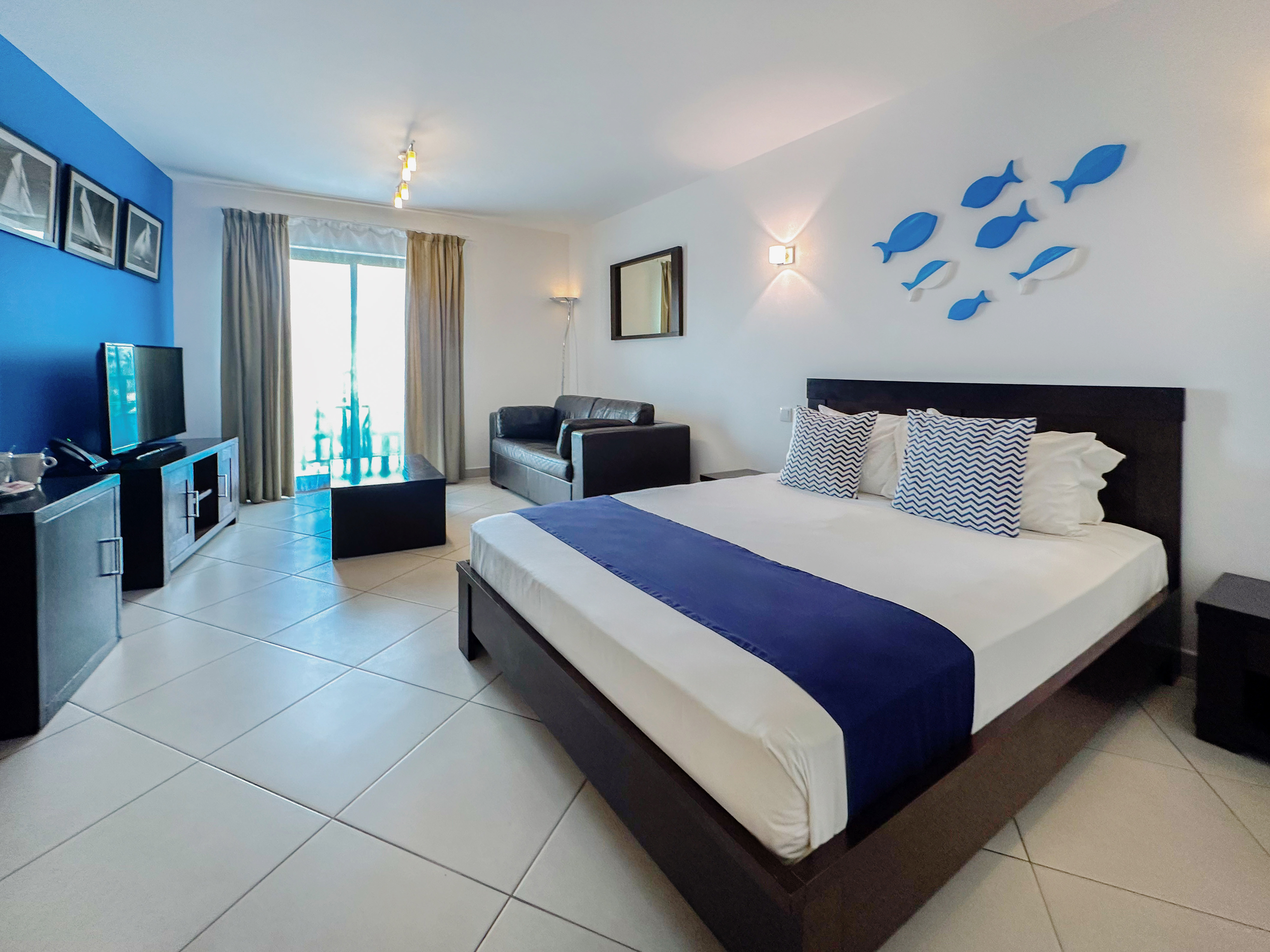 a bedroom with a bed and tv