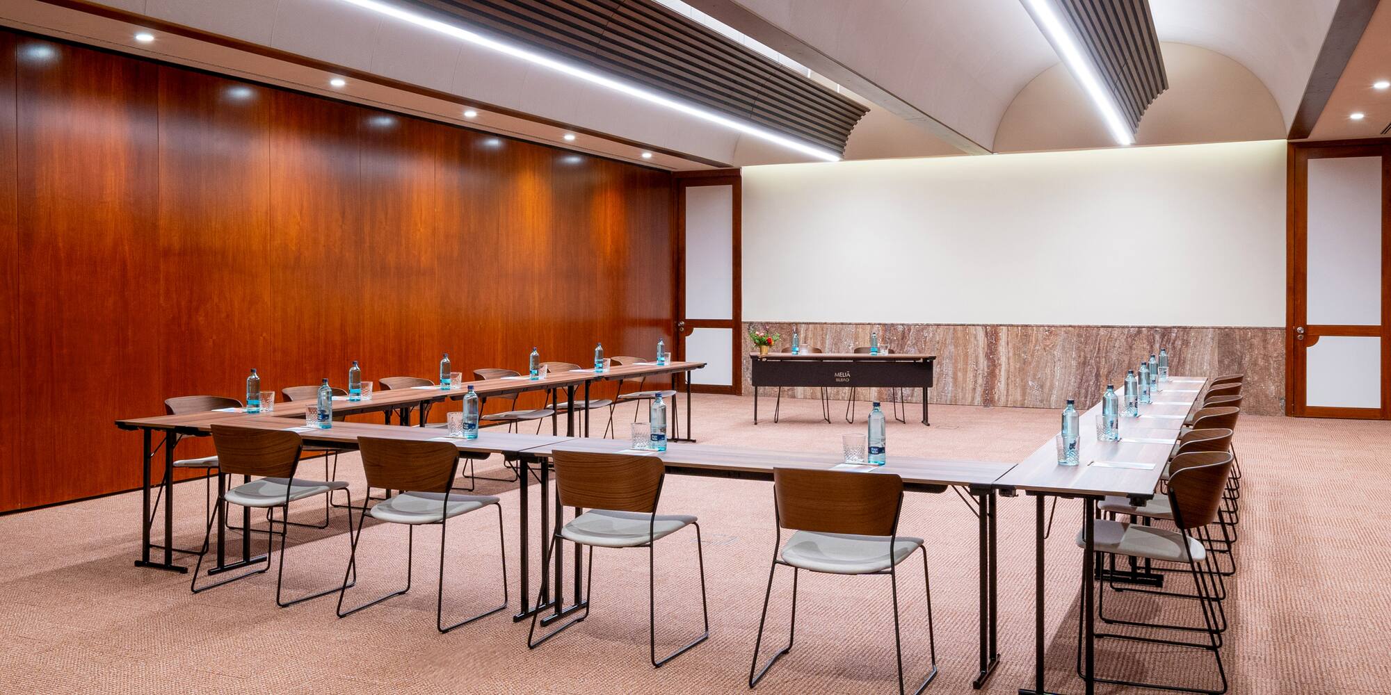 a room with a large table and chairs