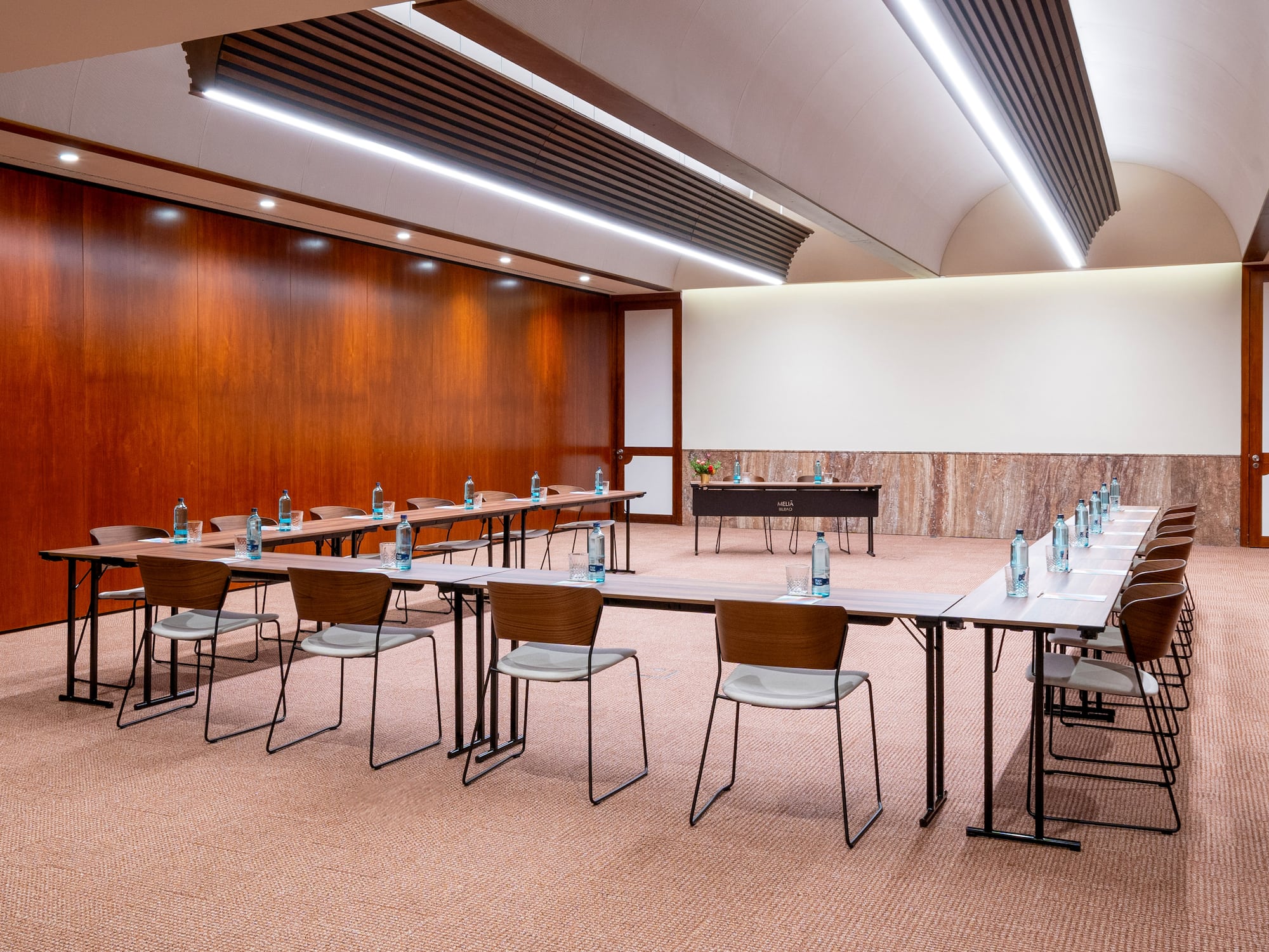 a room with a large table and chairs