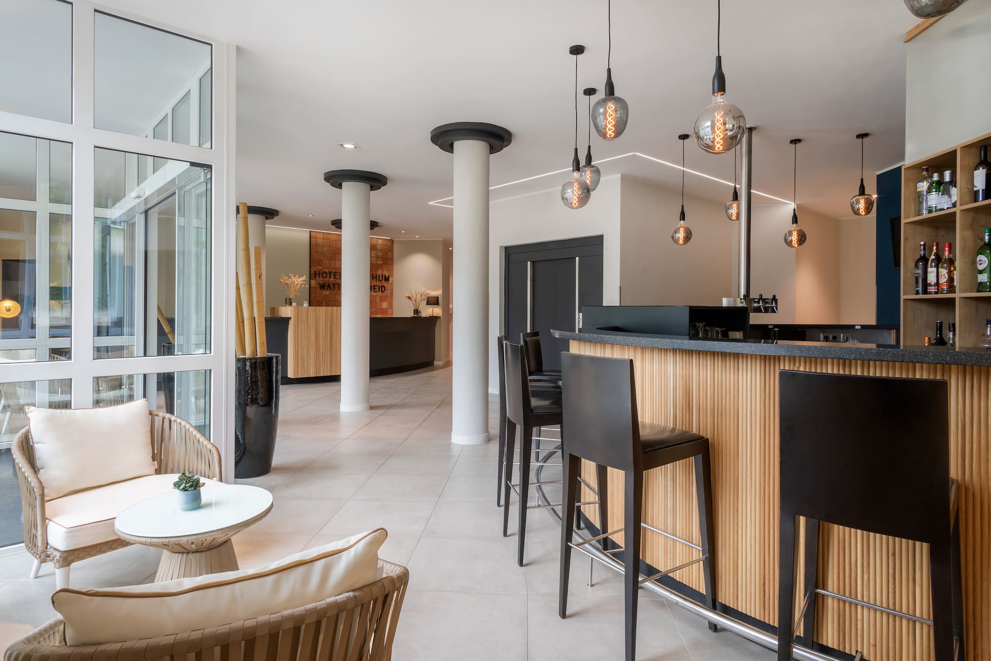 Modern hotel lobby with bar, reception, and lounge seating. Contemporary design.