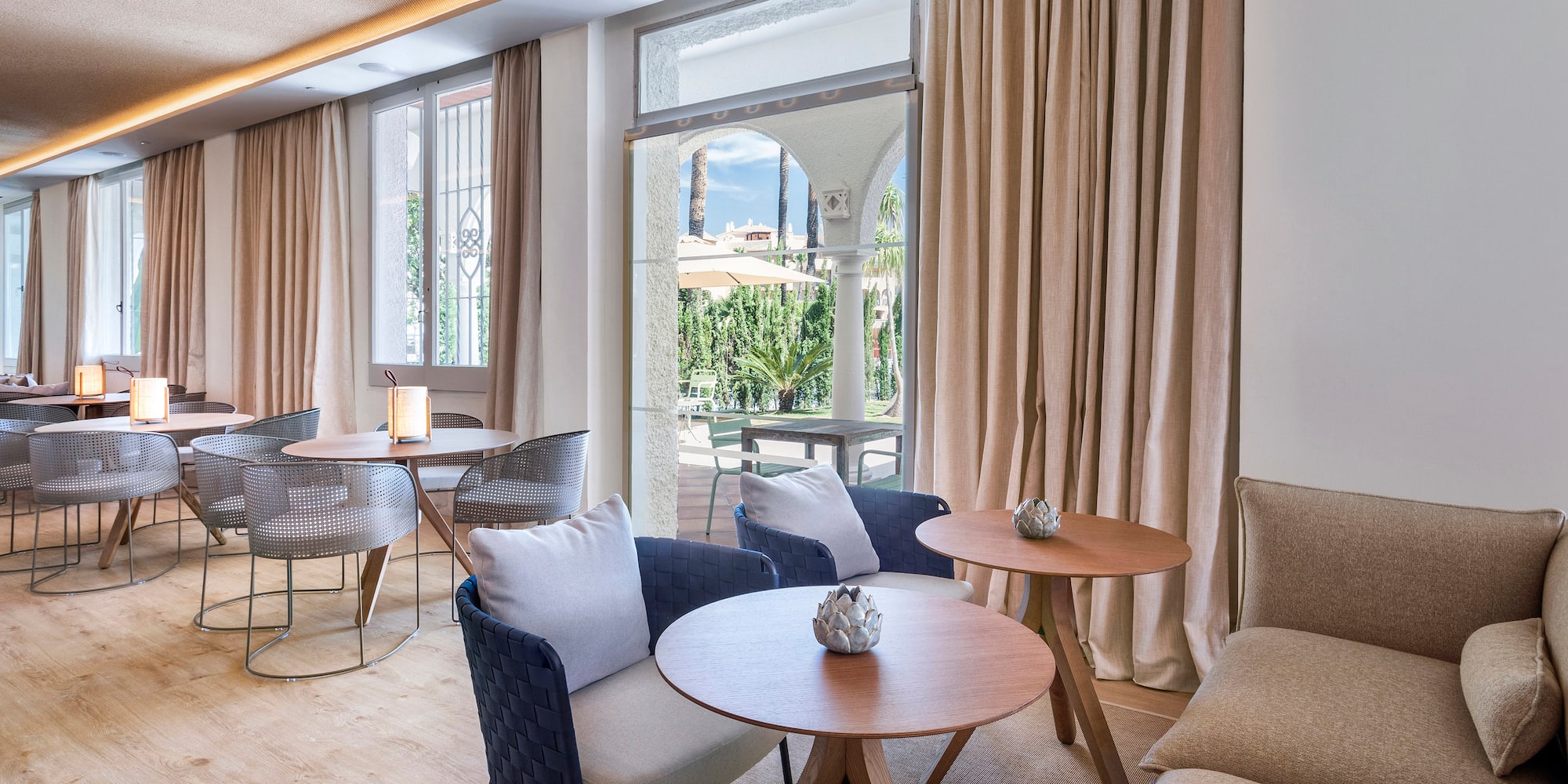 a room with a couch and tables