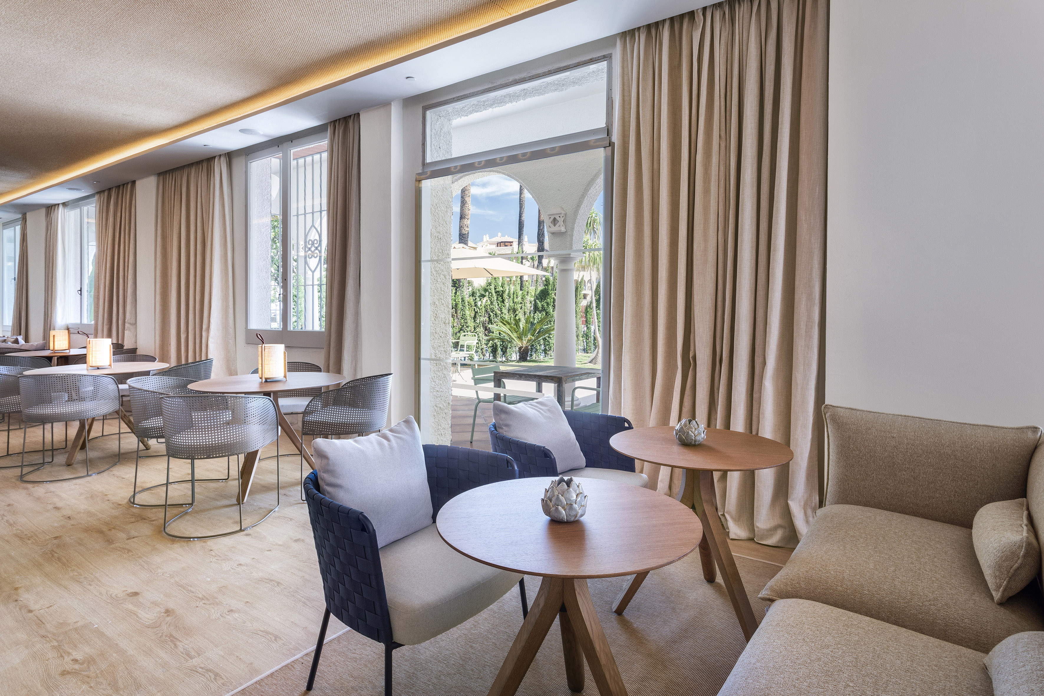 a room with a couch and tables