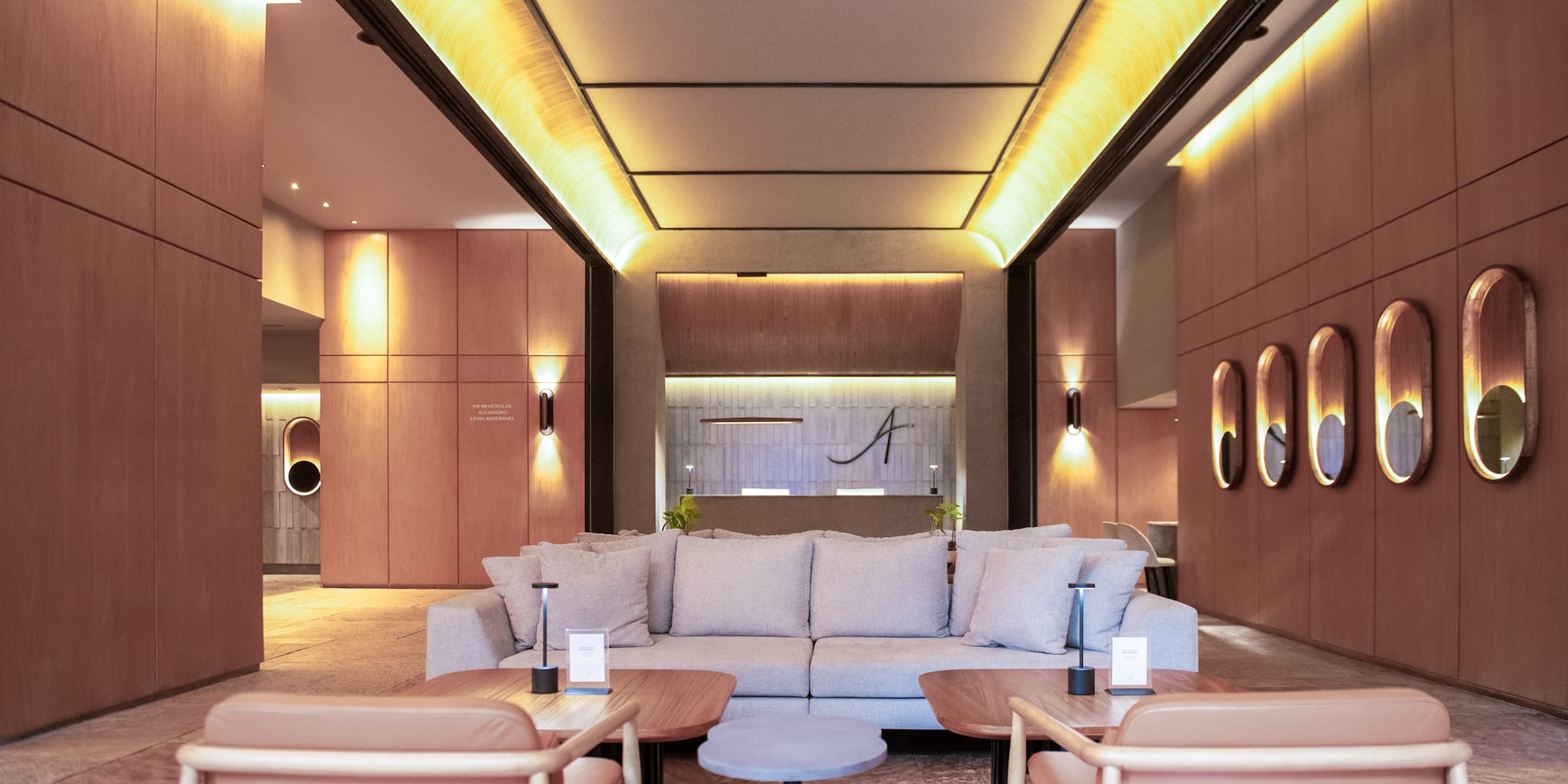 a room with a couch and chairs