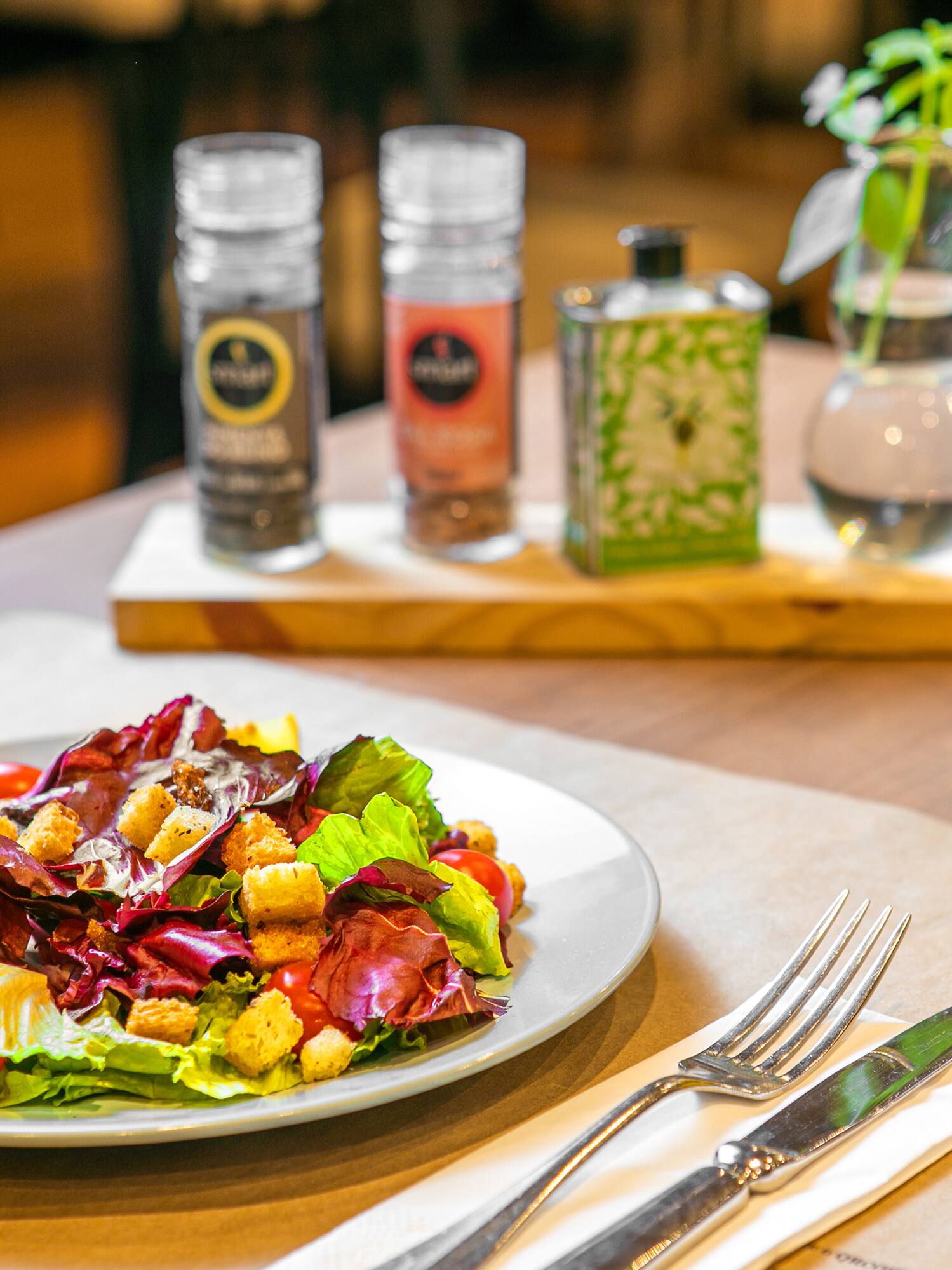 a plate of salad and a glass of juice