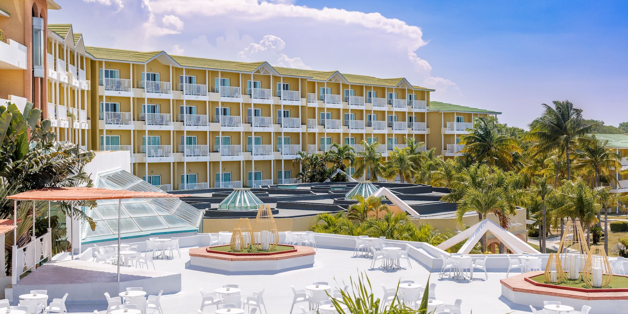 a building with many white tables and chairs