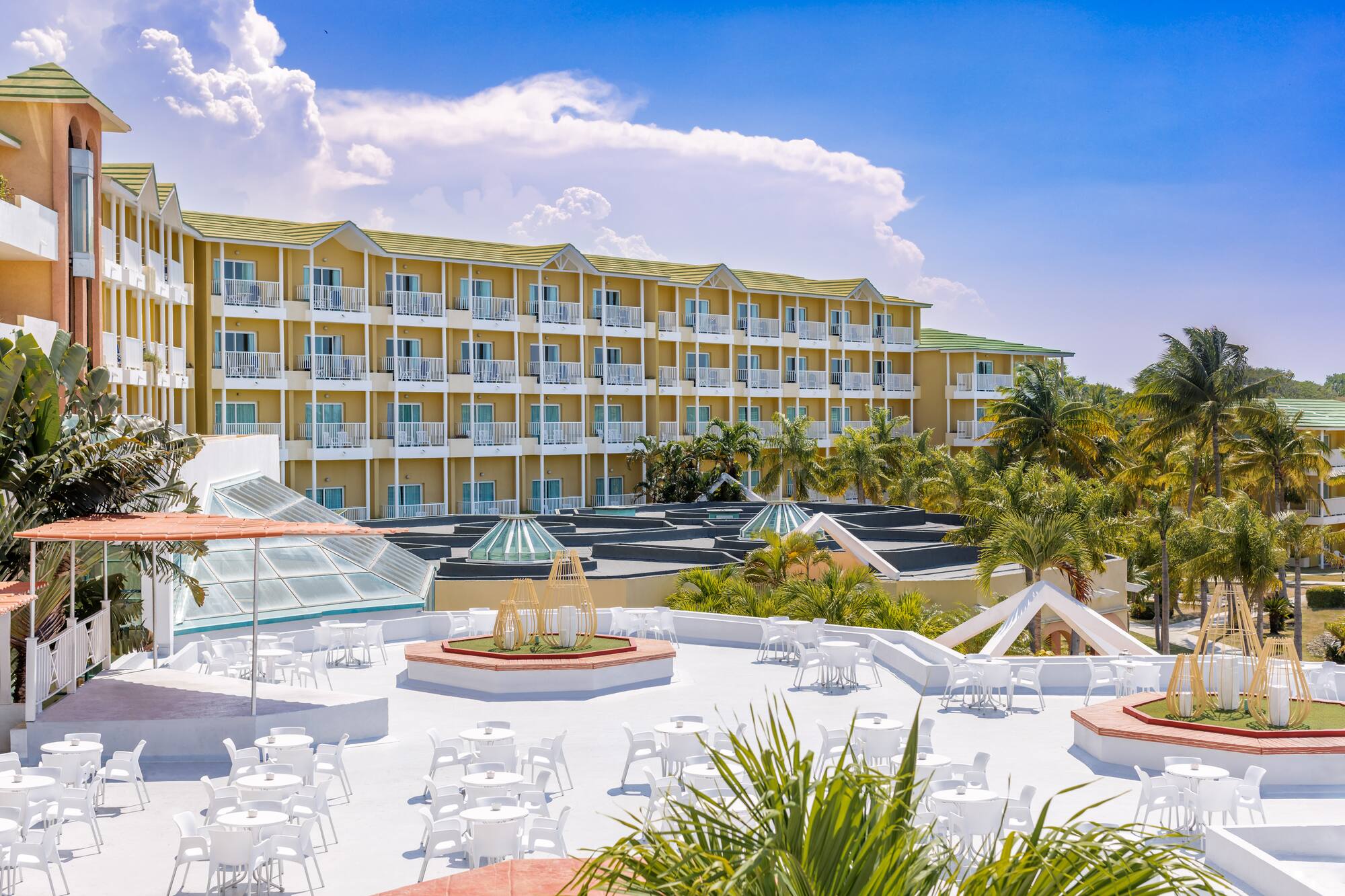 a building with many white tables and chairs