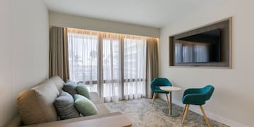 a room with a couch and a tv