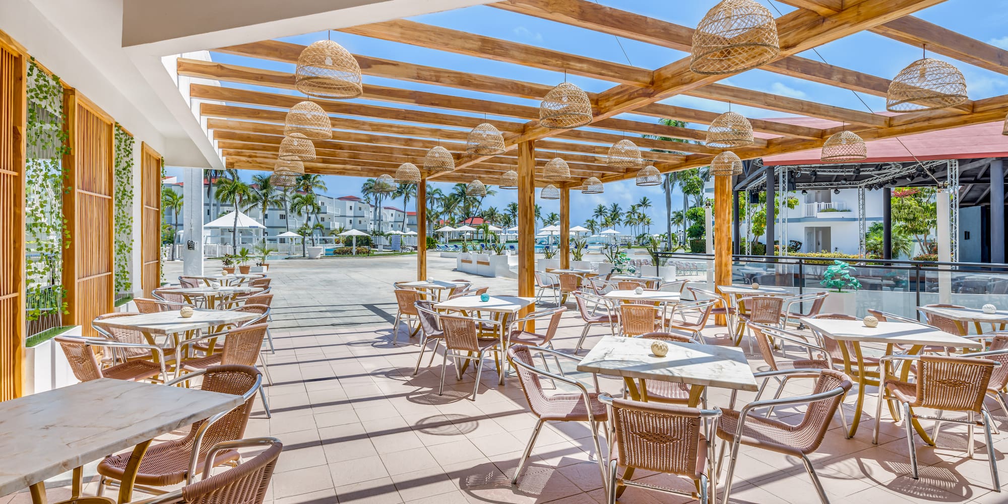 a patio with tables and chairs