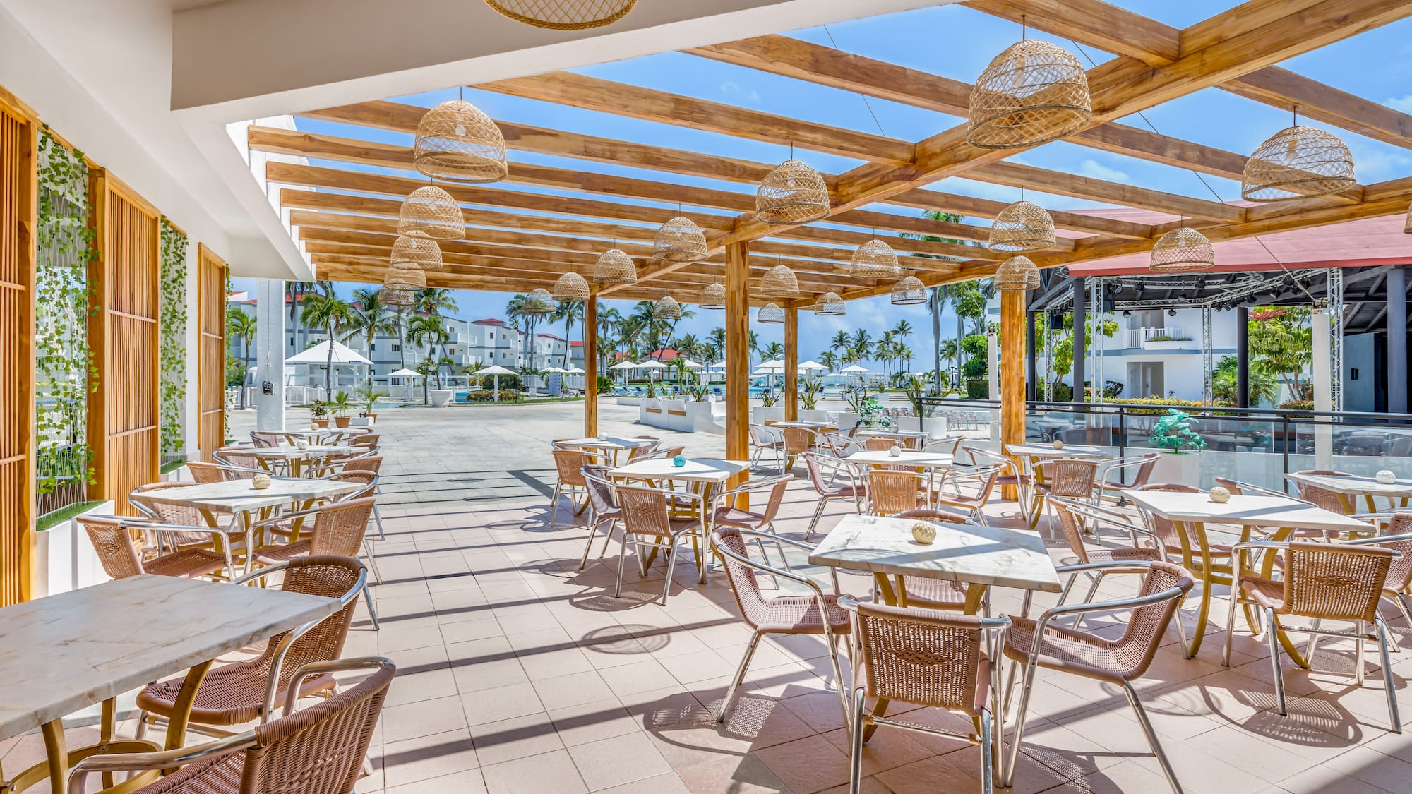 a patio with tables and chairs