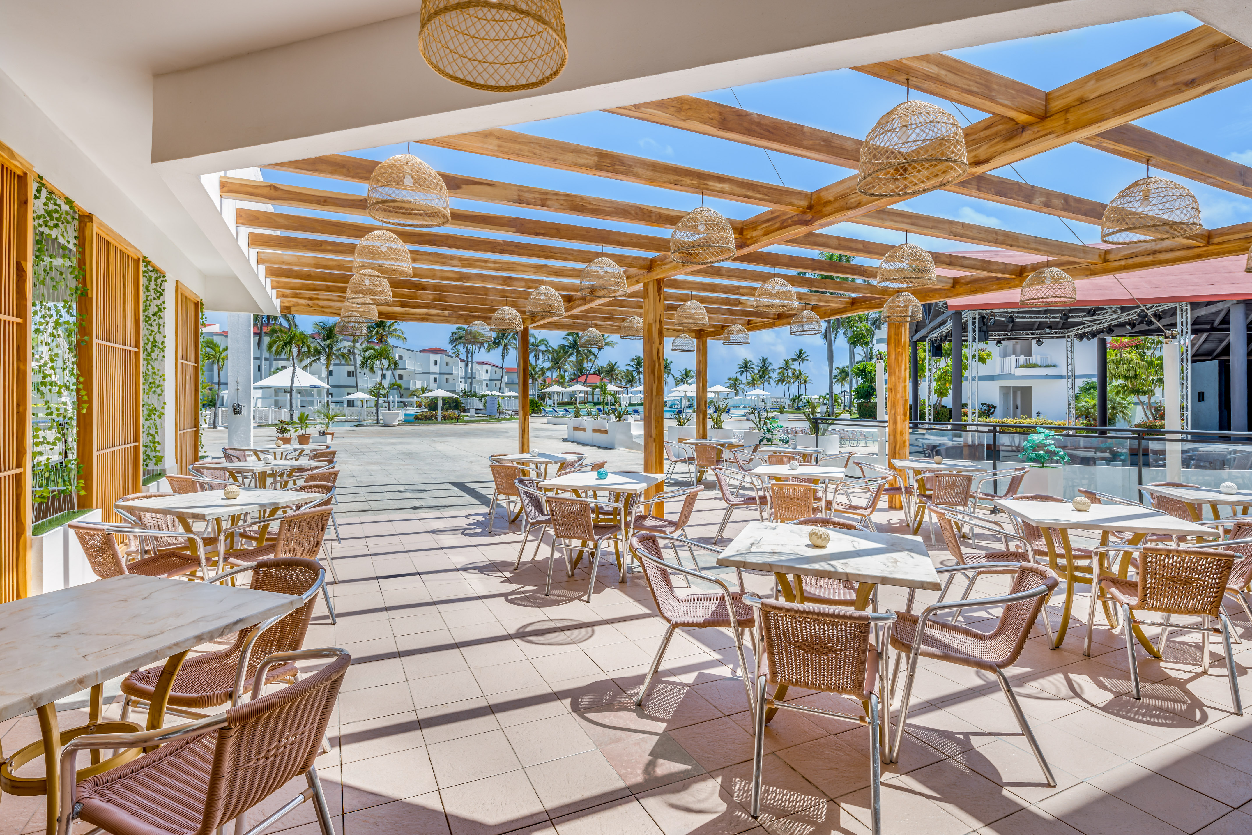 a patio with tables and chairs