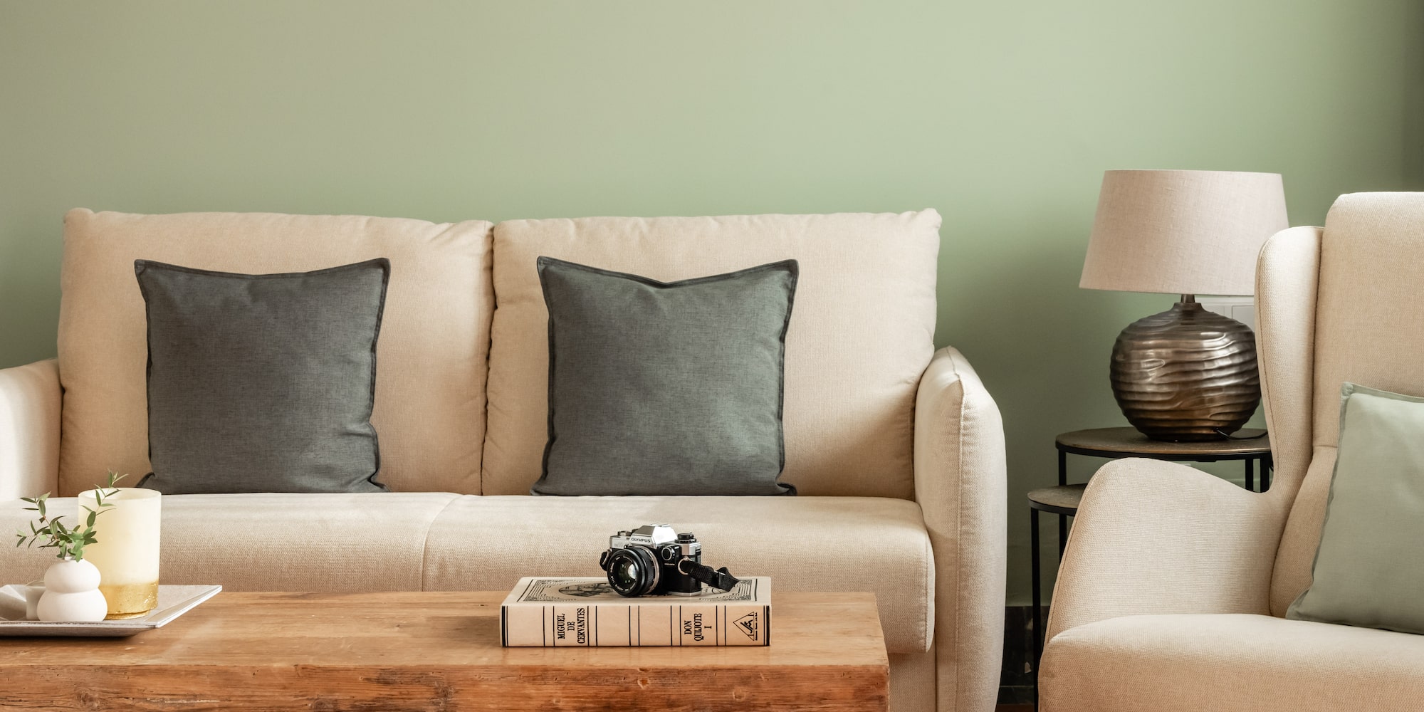 a couch with pillows and a coffee table