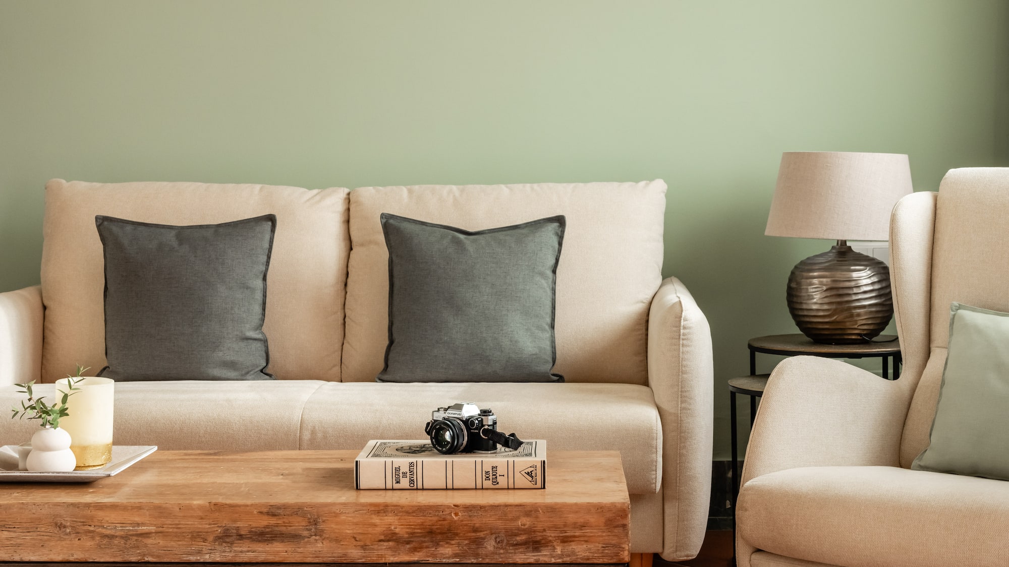 a couch with pillows and a coffee table