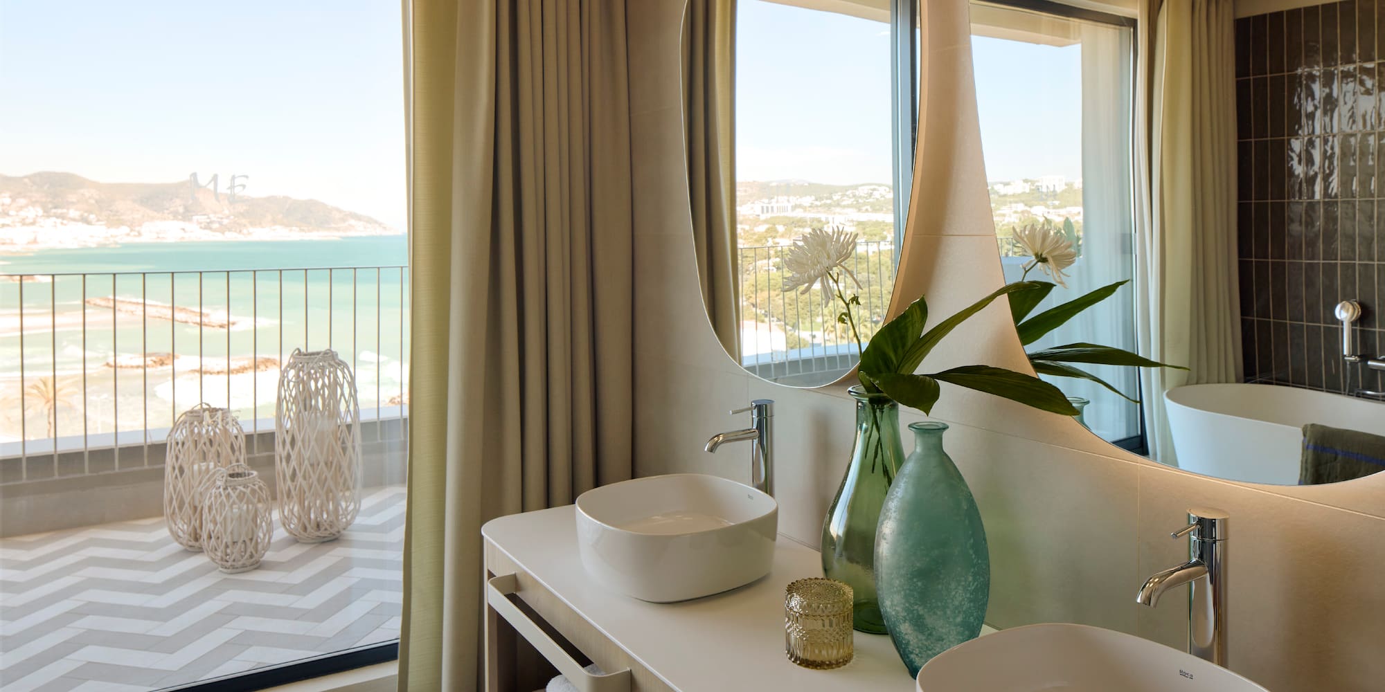a bathroom with a large mirror and two sinks
