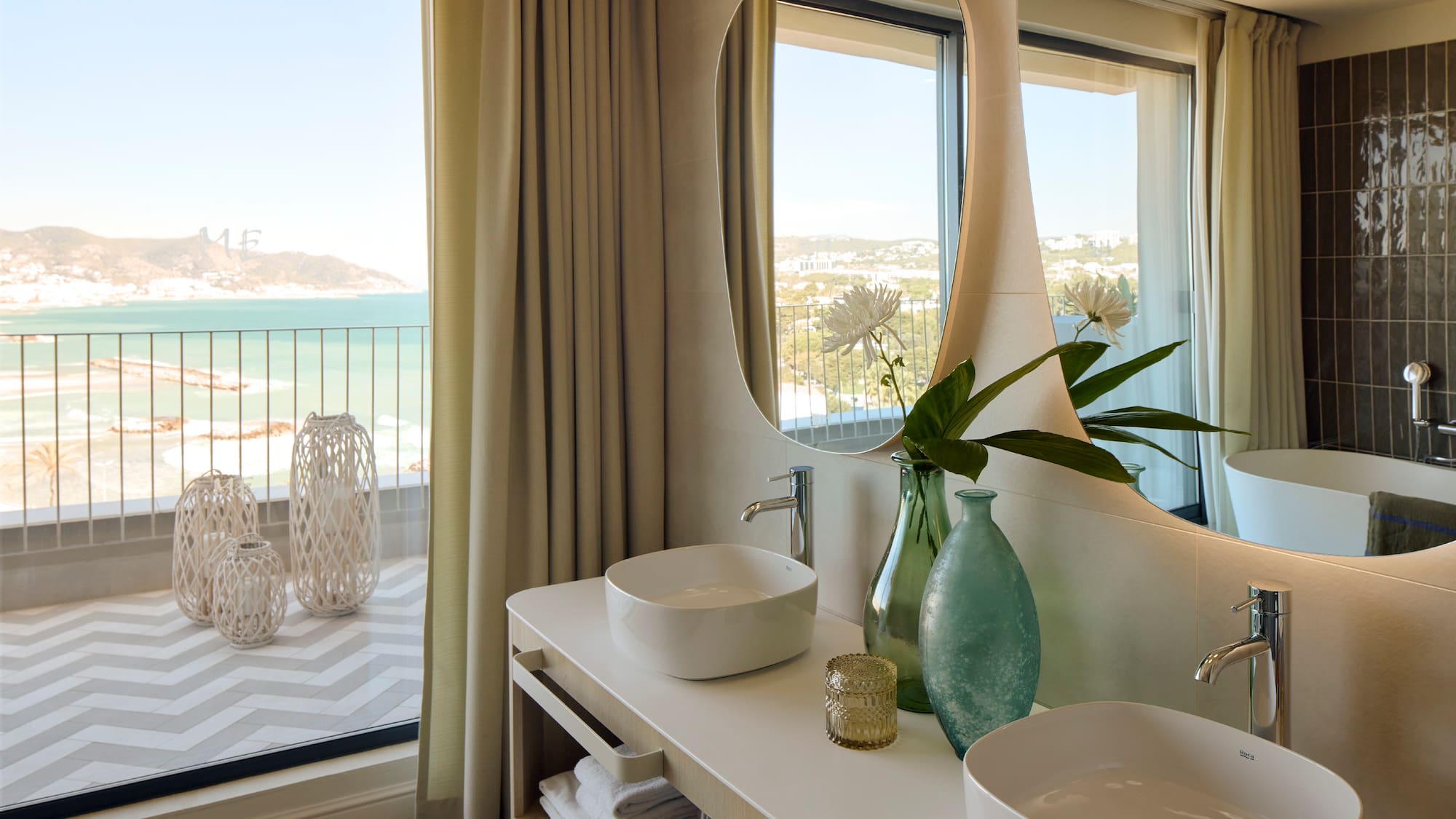 a bathroom with a large mirror and two sinks