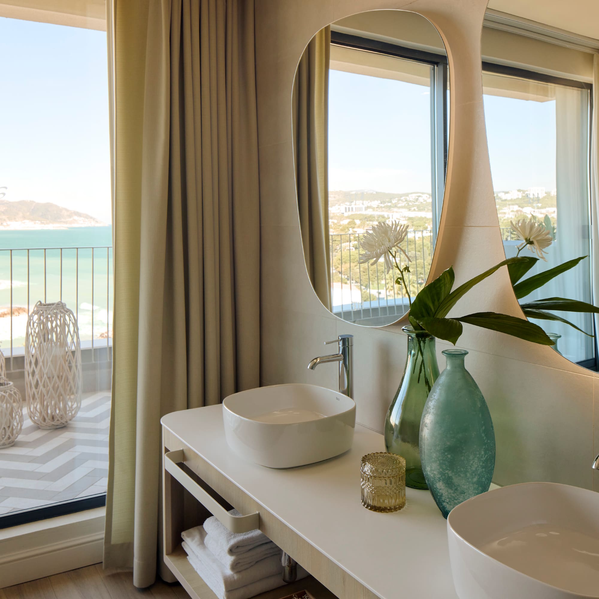 a bathroom with a large mirror and two sinks