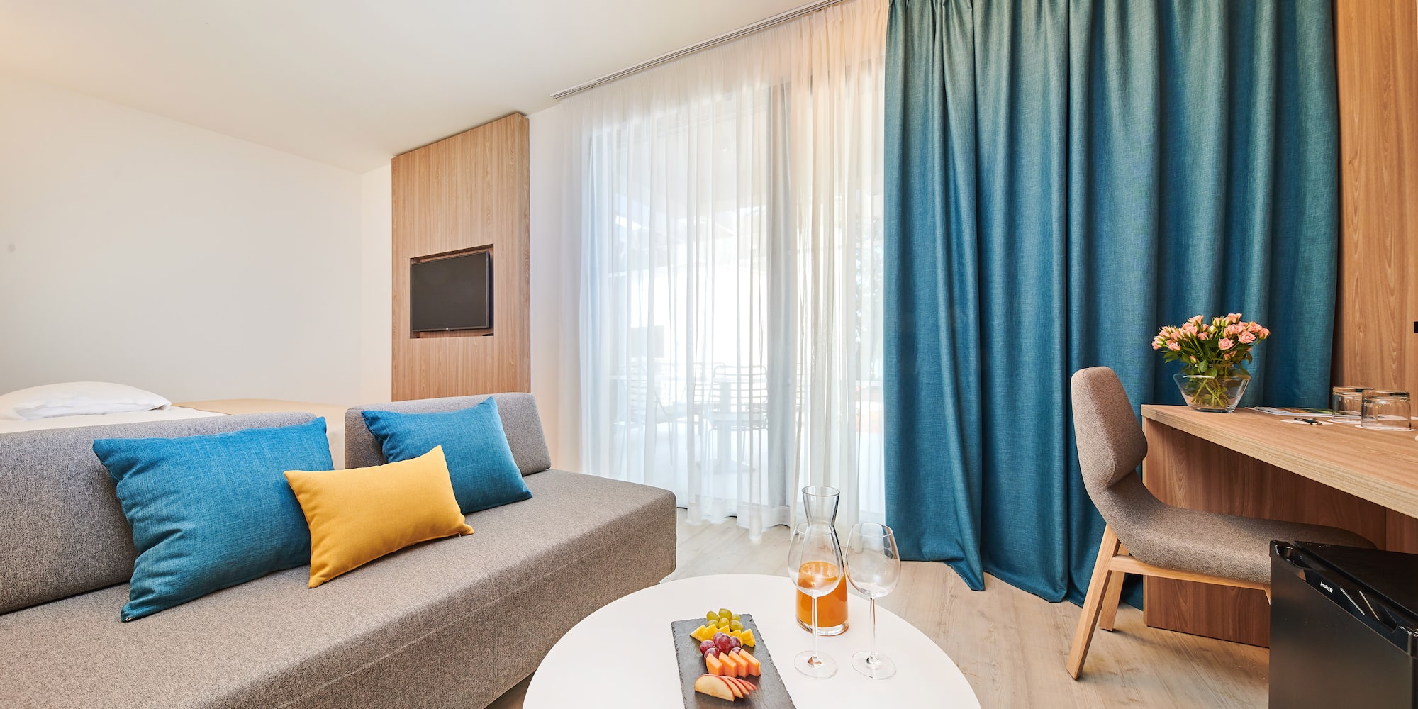 a room with a couch and a table with food on it