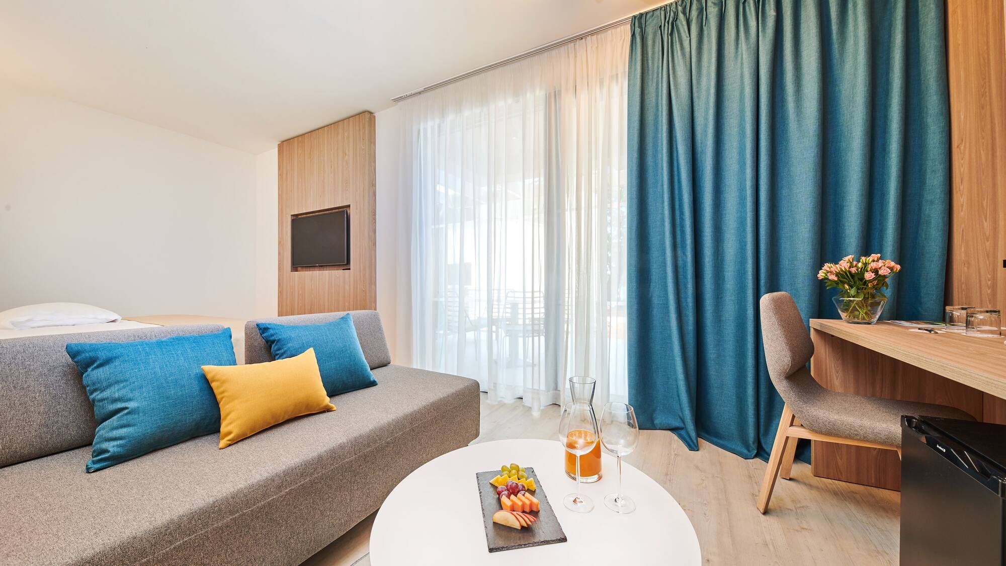 a room with a couch and a table with food on it