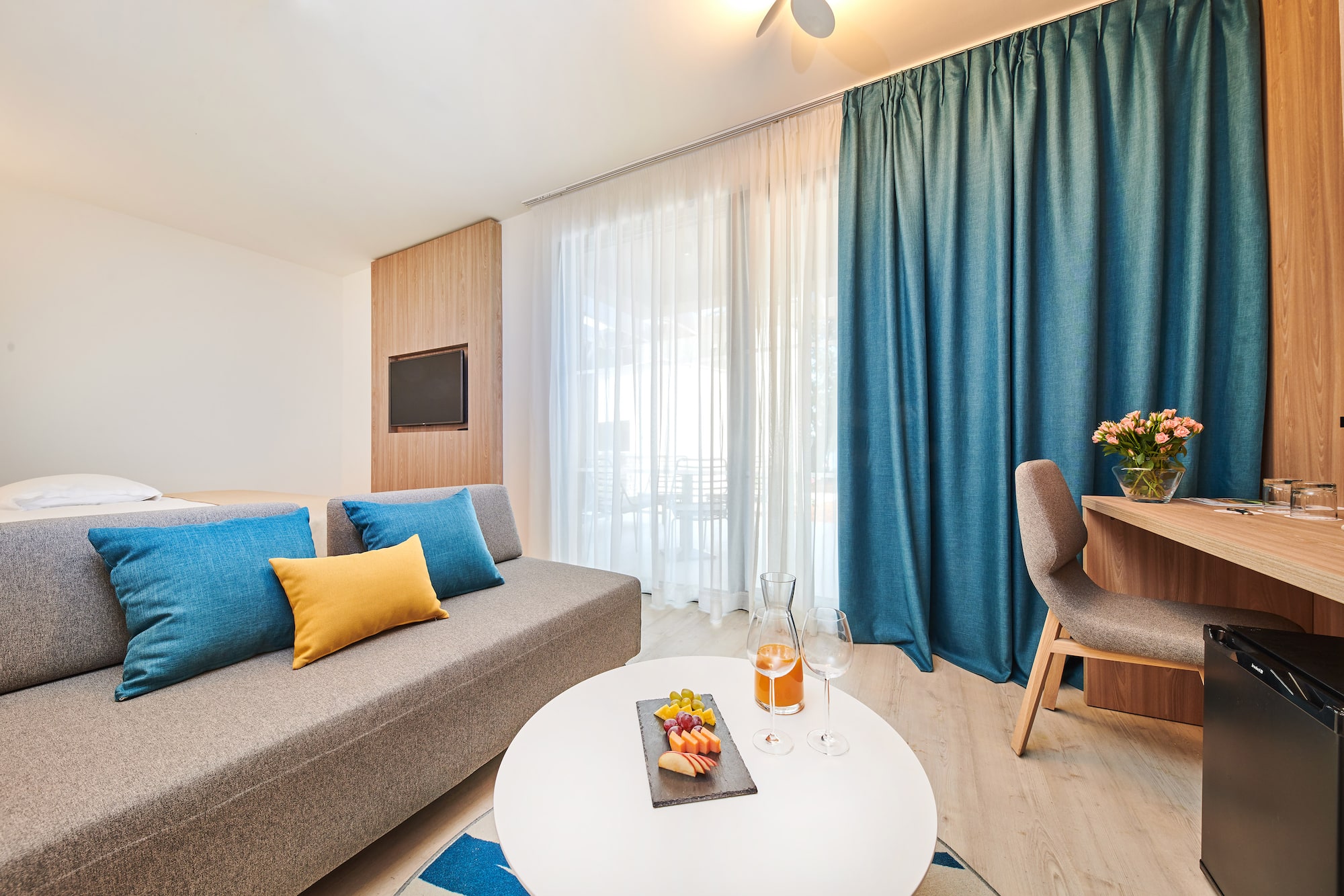 a room with a couch and a table with food on it