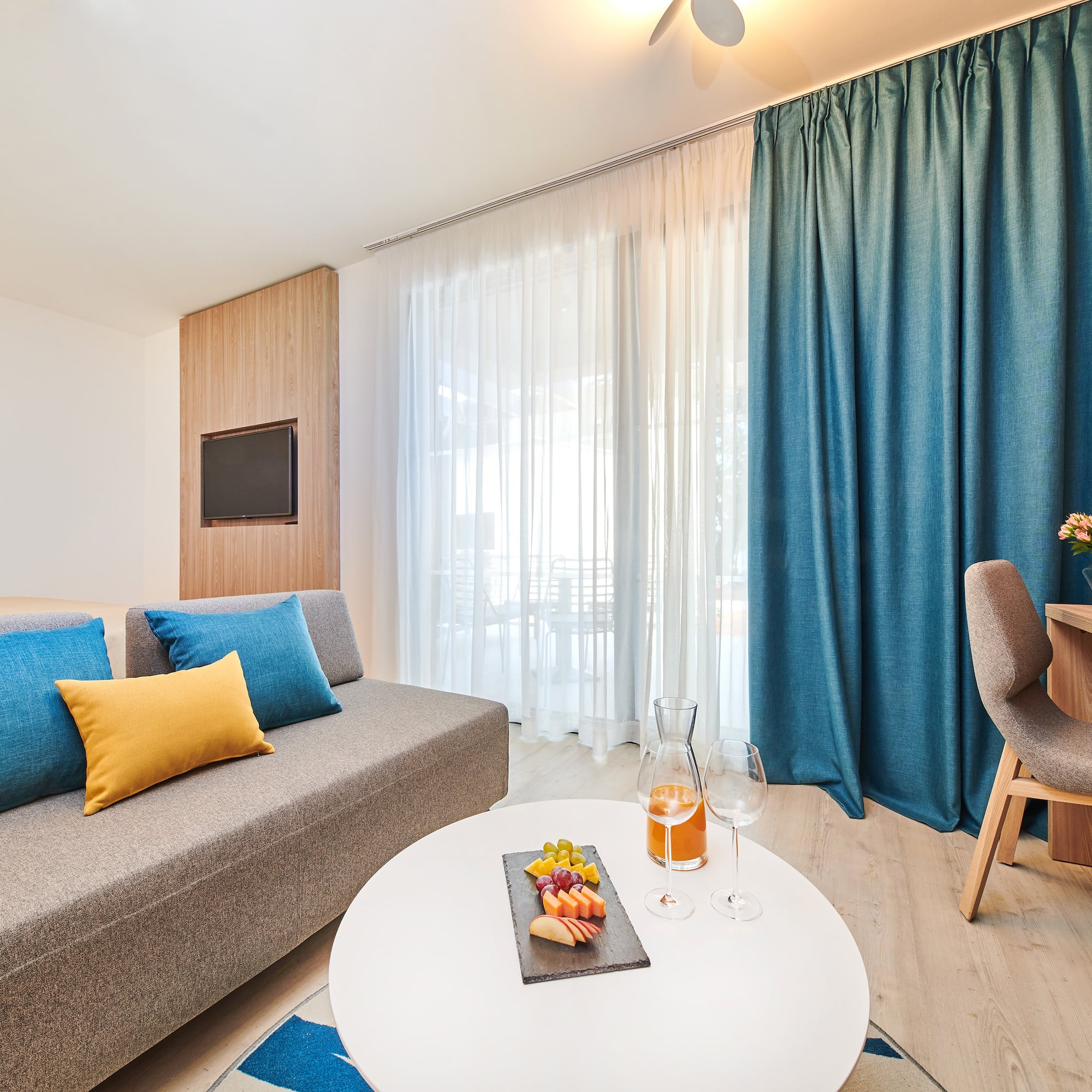 a room with a couch and a table with food on it