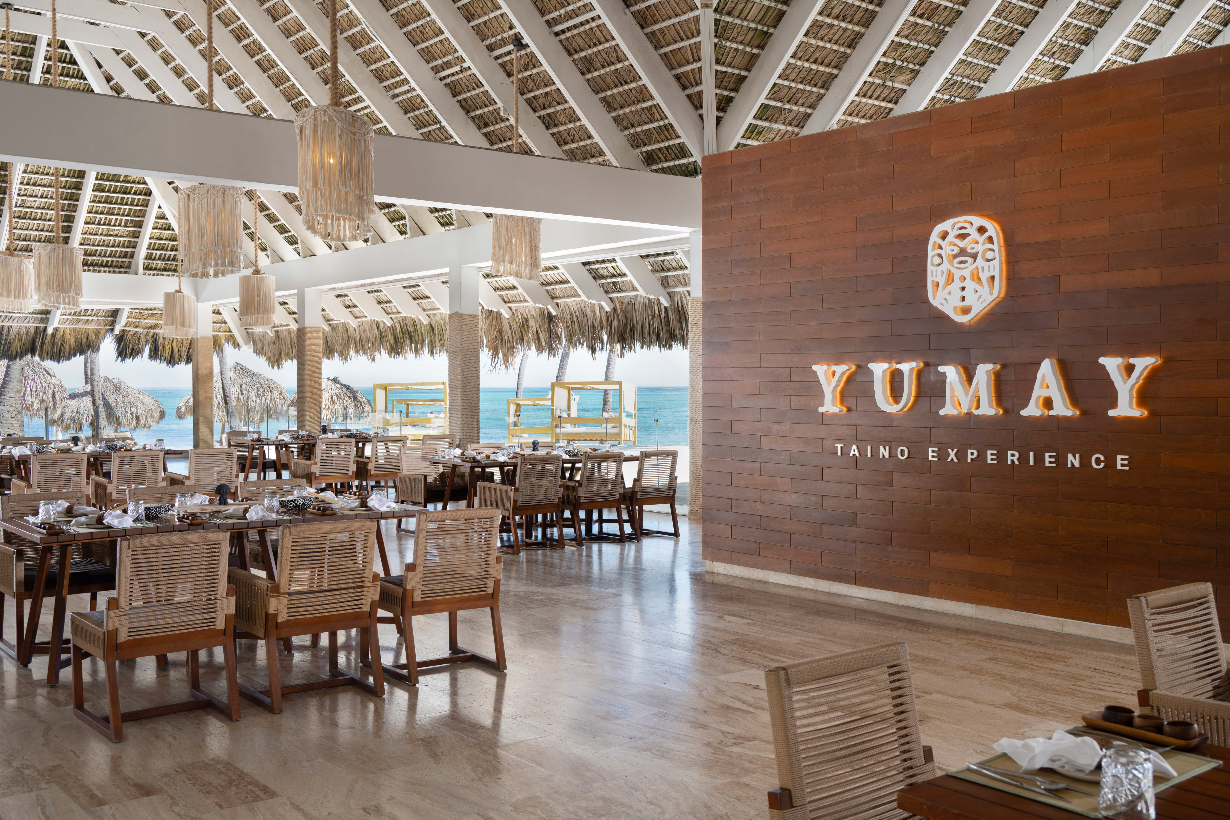 Yumay Taino Experience beachfront restaurant, ocean view, thatch roof.