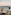 Oceanfront sunset dinner for two, with distant islands and mountains.
