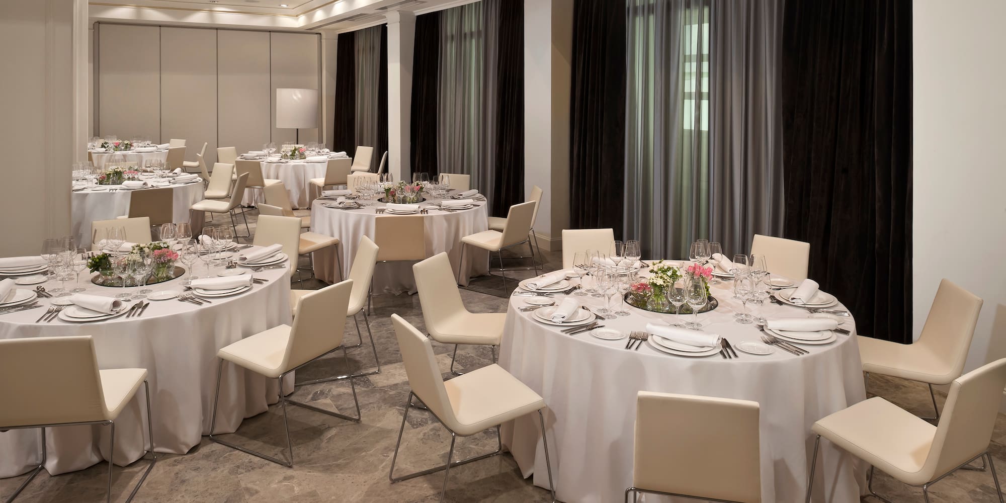 a room with tables and chairs