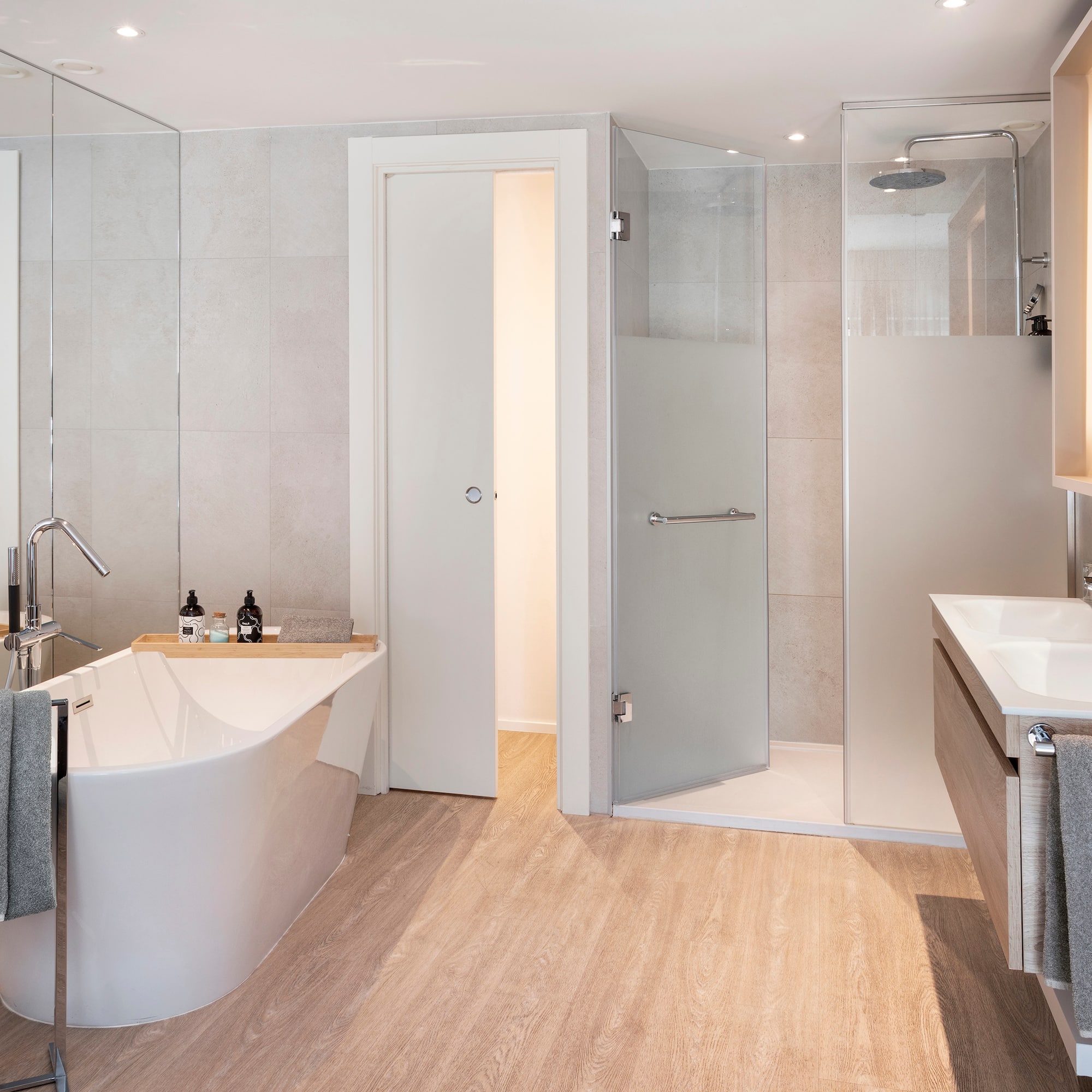 a bathroom with a tub and shower