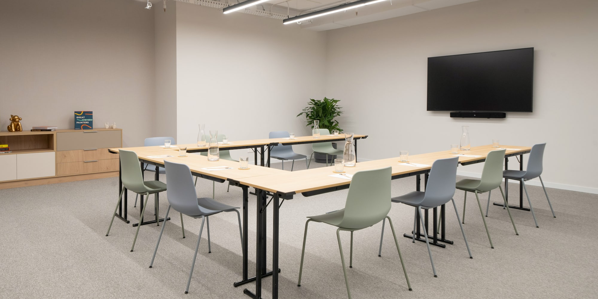 a room with a large table and chairs