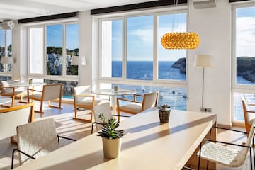 a room with a large window overlooking the ocean