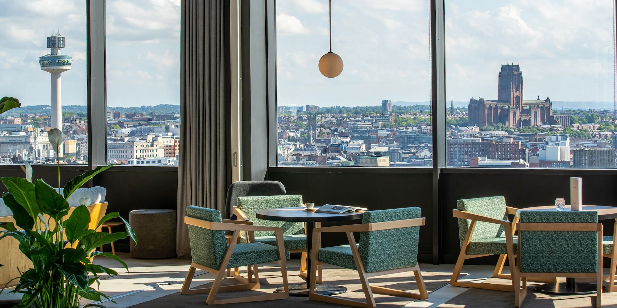 a room with a large window and a city view