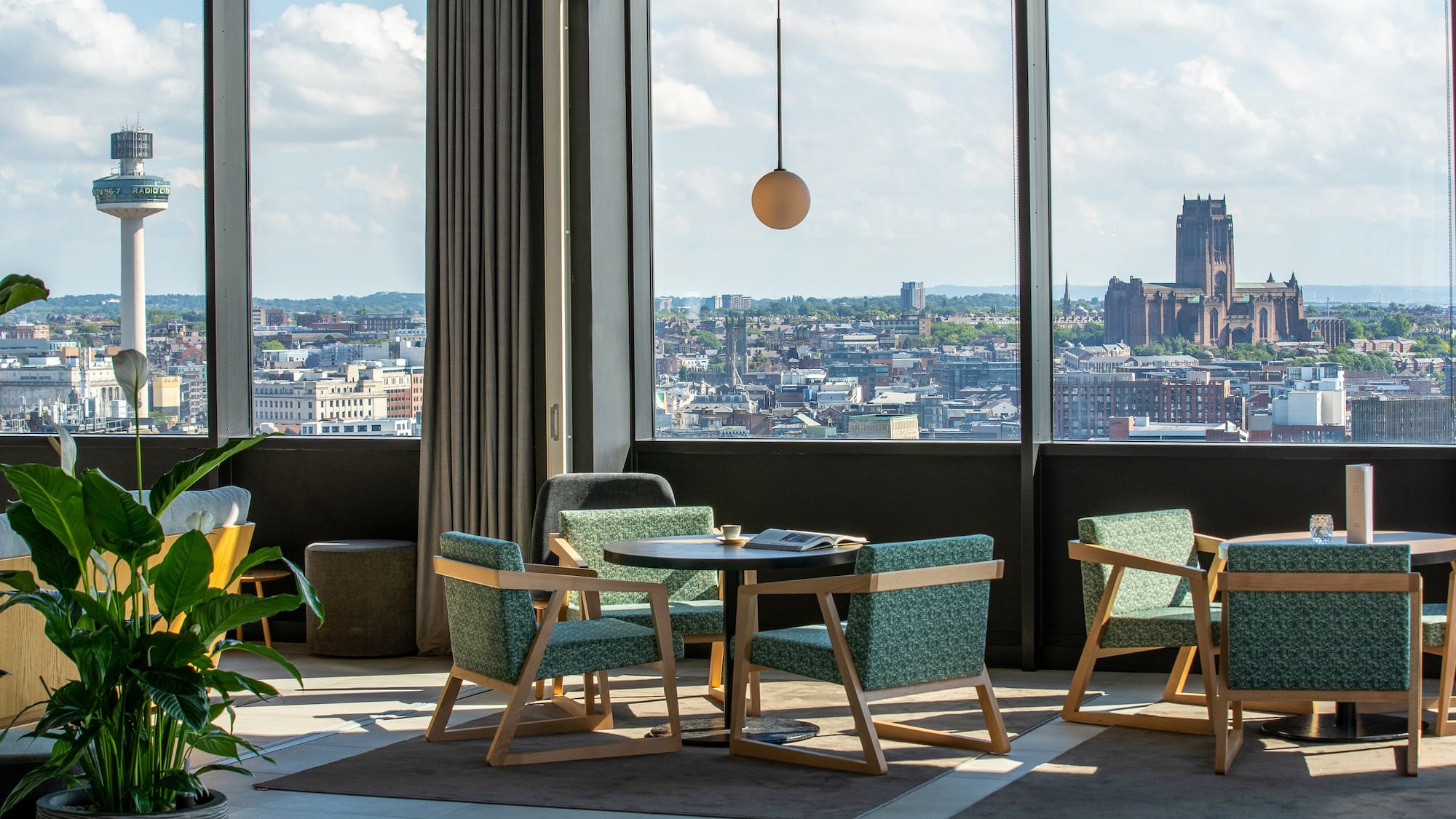 a room with a large window and a city view