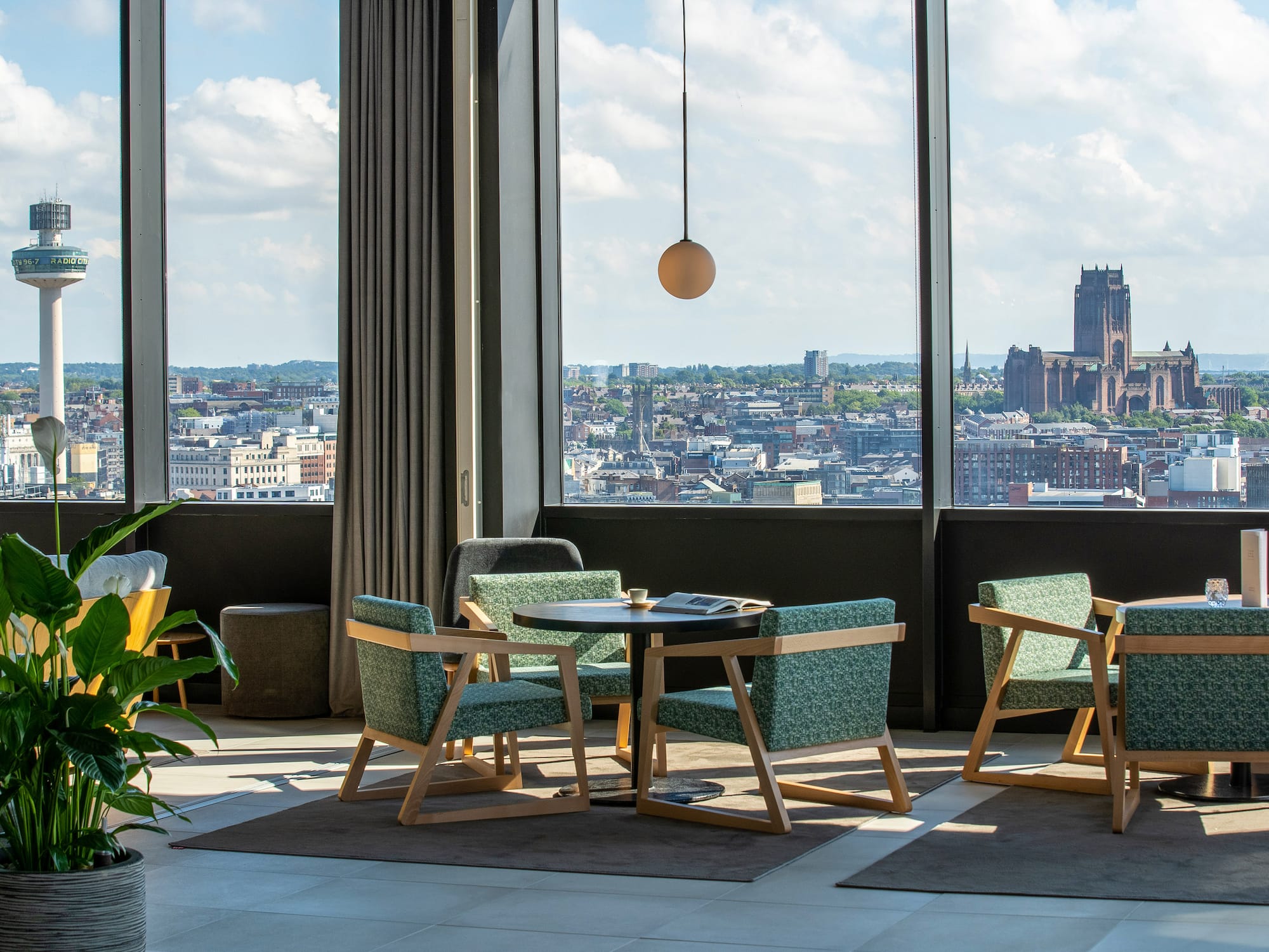a room with a large window and a city view