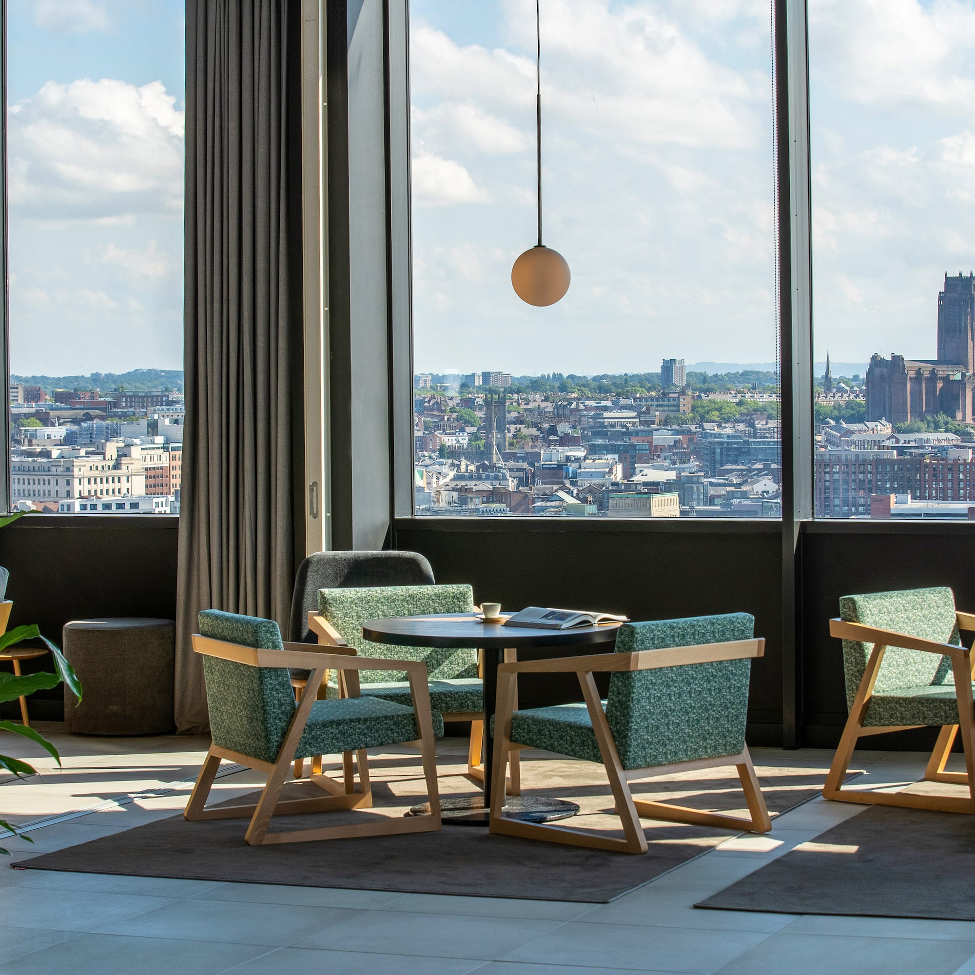 a room with a large window and a city view