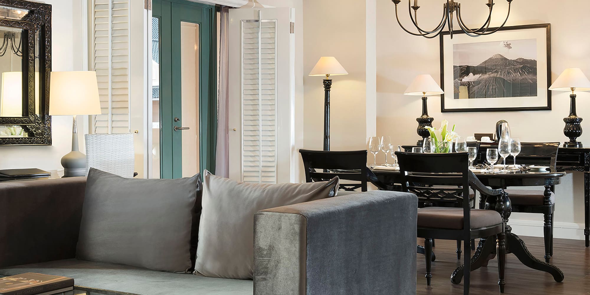 a living room with a couch and dining table