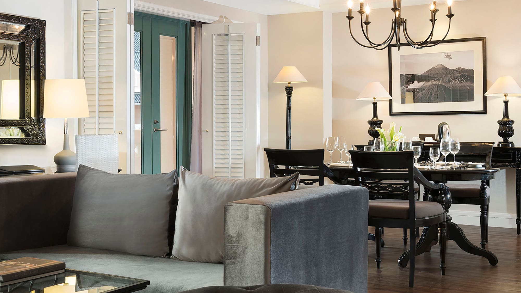 a living room with a couch and dining table