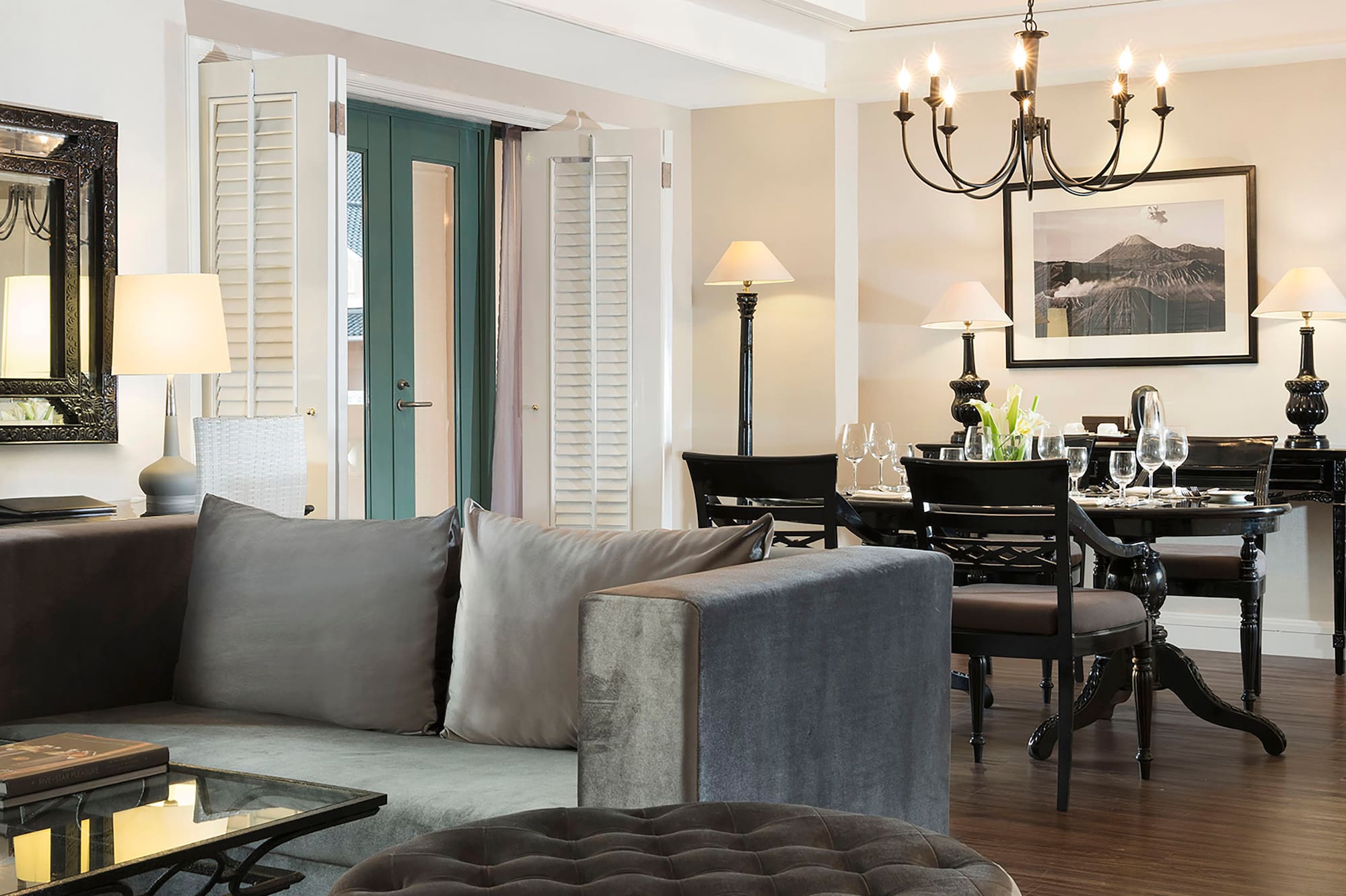 a living room with a couch and dining table