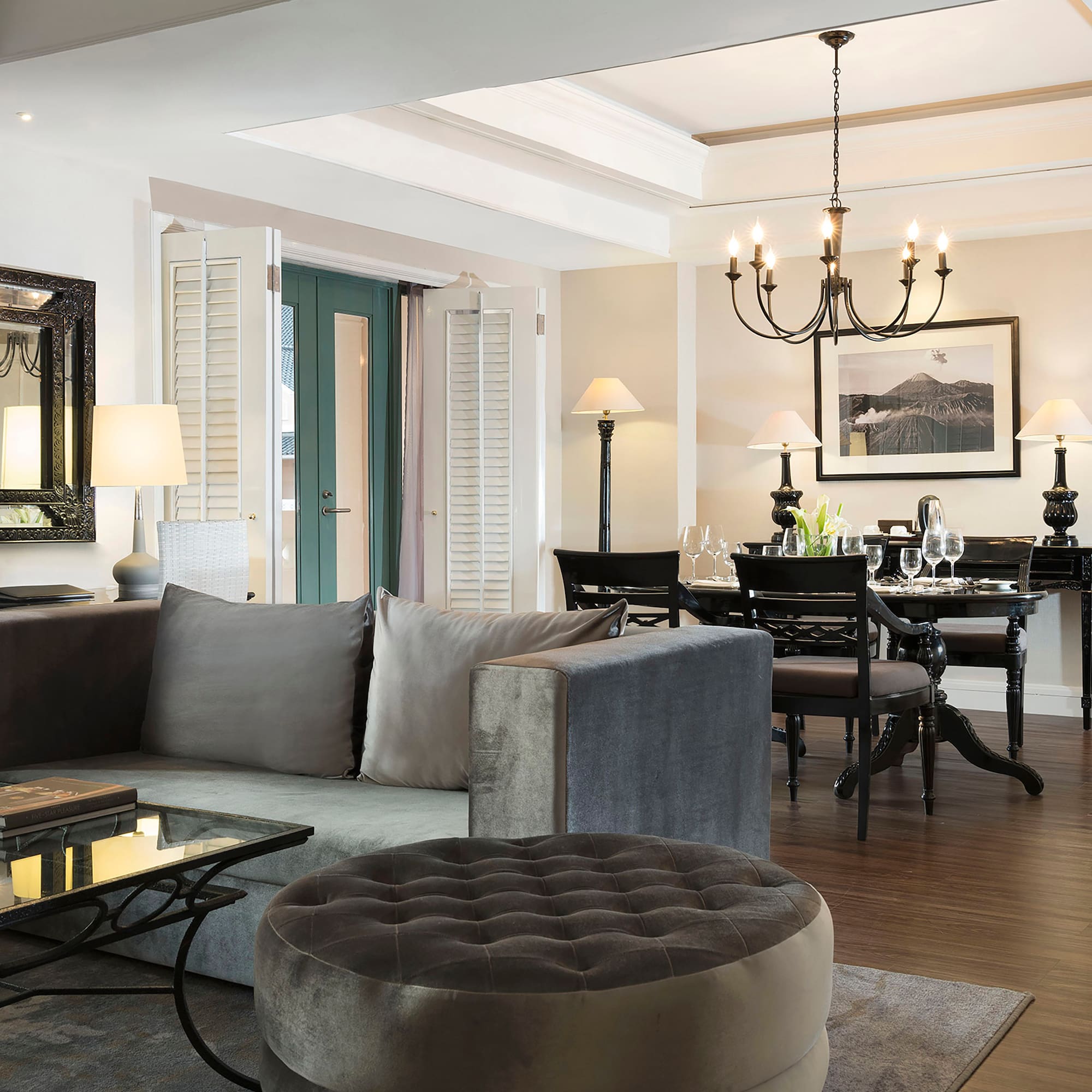 a living room with a couch and dining table